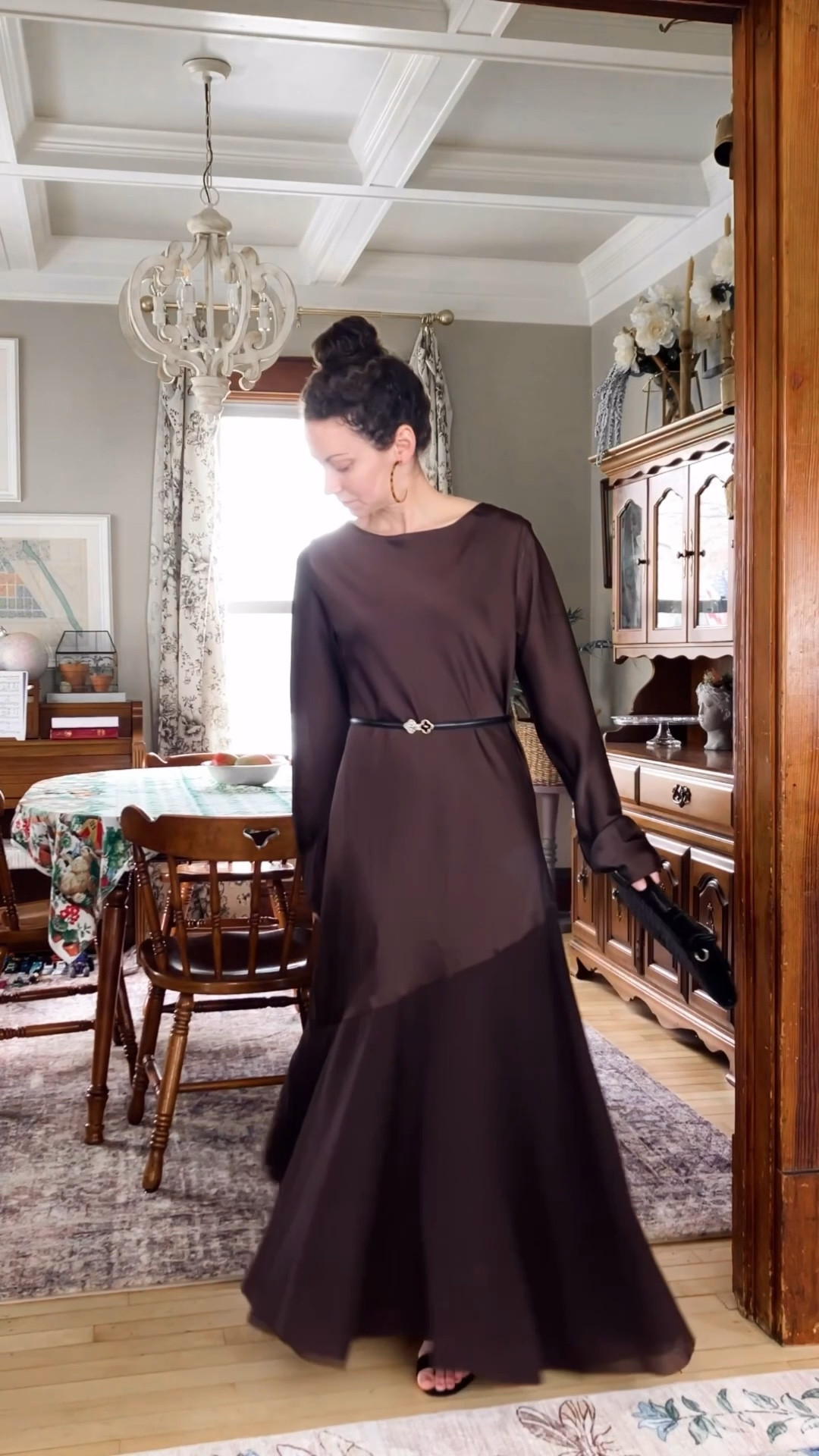 A beautiful wedding guest dress!
Brown satin maxi dress from Chicwish. 
Tortoise shell and gold large hoop earrings from Uncommon James. 
Black woven handbag from Chicwish. 
Black belt from Chicwish. 
Black suede block heel sandals from Steve Madden. 
Floral satin robe from Amazon  
Wedding guest dress. Summer wedding. Modest dress. Neutral outfit. Feminine outfit. Elegant outfit. 

#LTKSeasonal #LTKOver40 #LTKWedding