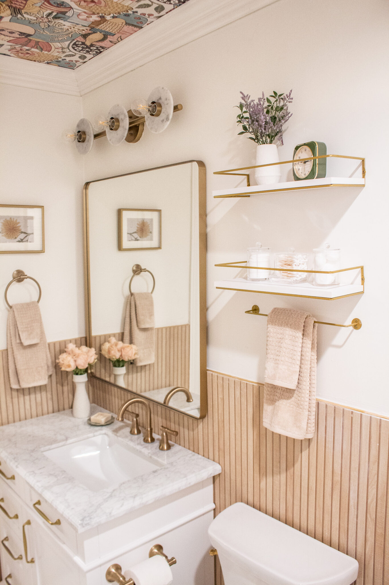 Soft neutral bathroom refresh with warm brass accents, fluted wood detail, and classic marble. I love mixing timeless finishes with practical storage to make a small space feel elevated and functional. This look is all about layered neutrals, warm metals, and simple decor that never goes out of style. Perfect inspiration for a powder bath or guest bathroom update.

#LTKHome #LTKSeasonal #LTKdayinmylife