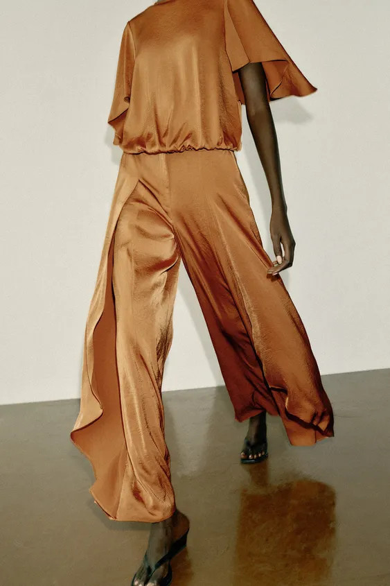 High-rise trousers with front pockets. Features a wide-leg fit with ruffle details. Front closure... | Zara US