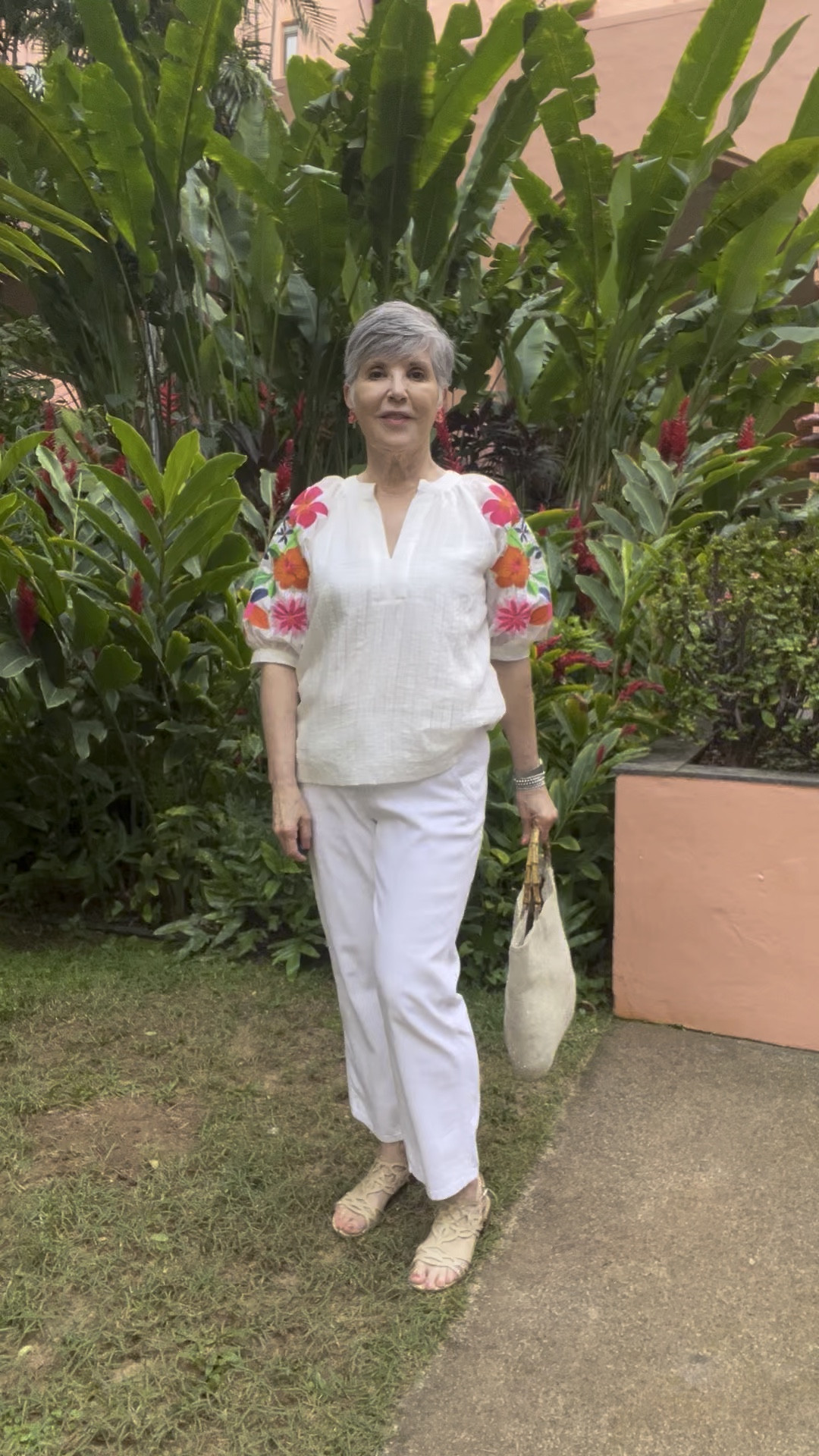 Don’t you love when you find a cute top that looks great with any kind of jeans, as well as white pants? THIS top with its really cool embroidered sleeves is so pretty. Perfect here with white pants, but it would be perfect with dark wash jeans 👖 for a girls brunch look! This is from a cute company called Avara. The bodice is lined which hides one’s bra. Yay! I added flat nude sandals, a tan bag and fun pink flowered earrings! Such a cute vacation/summer outfit! You will LOVE this top!

#LTKOver40 #LTKWatchNow #LTKFindsUnder50