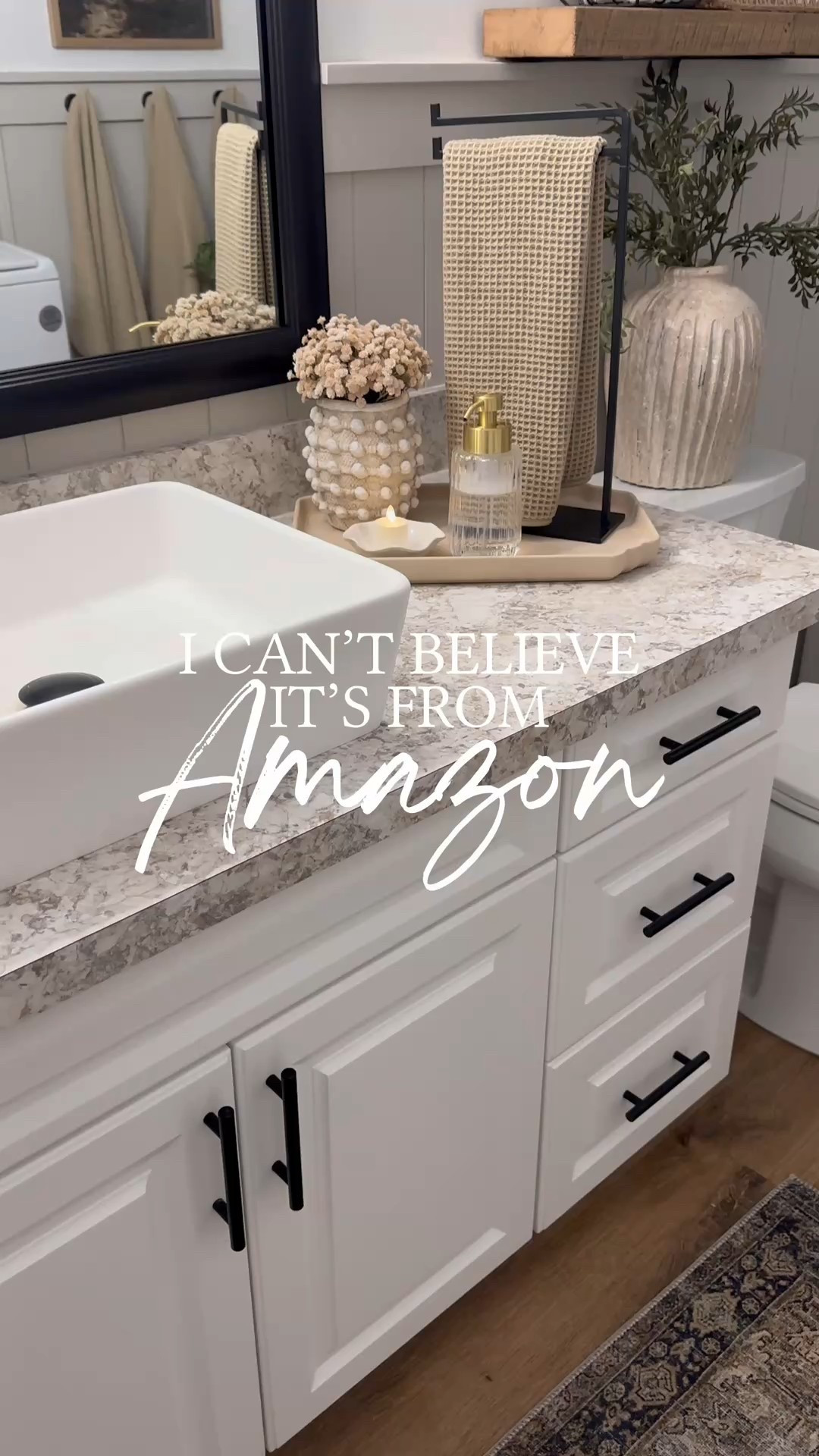 ✨I can’t believe it’s from Amazon! Follow @farmtotablecreations on Instagram for more inspiration.

How incredibly cute is this textured vase I found on Amazon? It’s a major designer look alike of a more expensive brand. I’m so impressed with the quality and it can be used anywhere.

I added some cute neutral stems and displayed it here in the bathroom. It fits perfectly on this tray and adds the best texture to this space.

For Reference: 
Vase is comparable in size to the Minka XS vase. 
9 stems shown in Amazon vase.
Weathered Vase on toilet tank is size small and has 3 stems.

Amazon Prime | Amazon | Amazon Home Finds | Loloi Rugs | Bathroom Decor | Bathroom Storage | Amazon Must Haves | Bathroom Shelves | Home Decorating | Decor Ideas | Budget Friendly Decor | Home Inspiration | Amazon Spring Sale | open shelves | Small Spaces | Bathroom Shelves | Small Bathroom Storage | Home Decor | Neutral Bathroom Decor | Loloi Rugs | Master Bedroom | Winter Decor | Winter Refresh | Living Room

#LTKFindsUnder50 #LTKHome #LTKSaleAlert