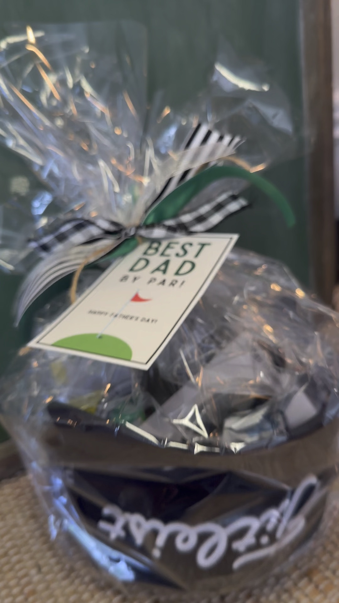 Best Dad By Par⛳️ This is such a fun gift for the golf dad! A new hat filled with golf gadgets. Wrapping it up in cellophane keeps it all together. The gift tag & ribbon completes this gift. Happy Gifting 🖤

#LTKGiftGuide #LTKMens #LTKVideo