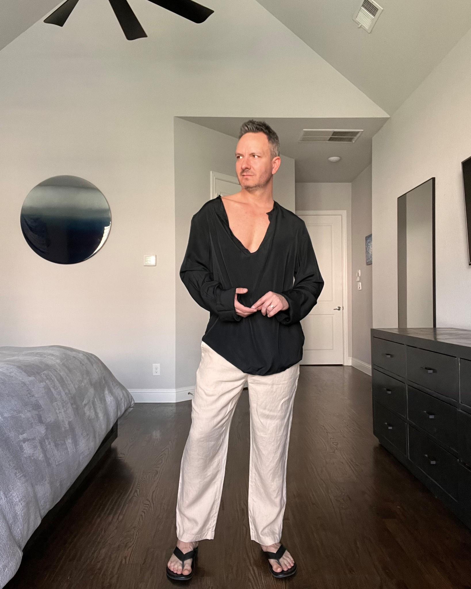 A draped black long sleeve shirt with a soft neckline makes this feel more refined than a basic tee. Paired with cropped trousers for that clean, modern silhouette. Ideal for vacation evenings, casual date nights, or walking a city like Barcelona or Miami.

#menswear #summeroutfitmen #minimalstyle #mensstyleguide

#LTKootd #LTKSeasonal #LTKMens