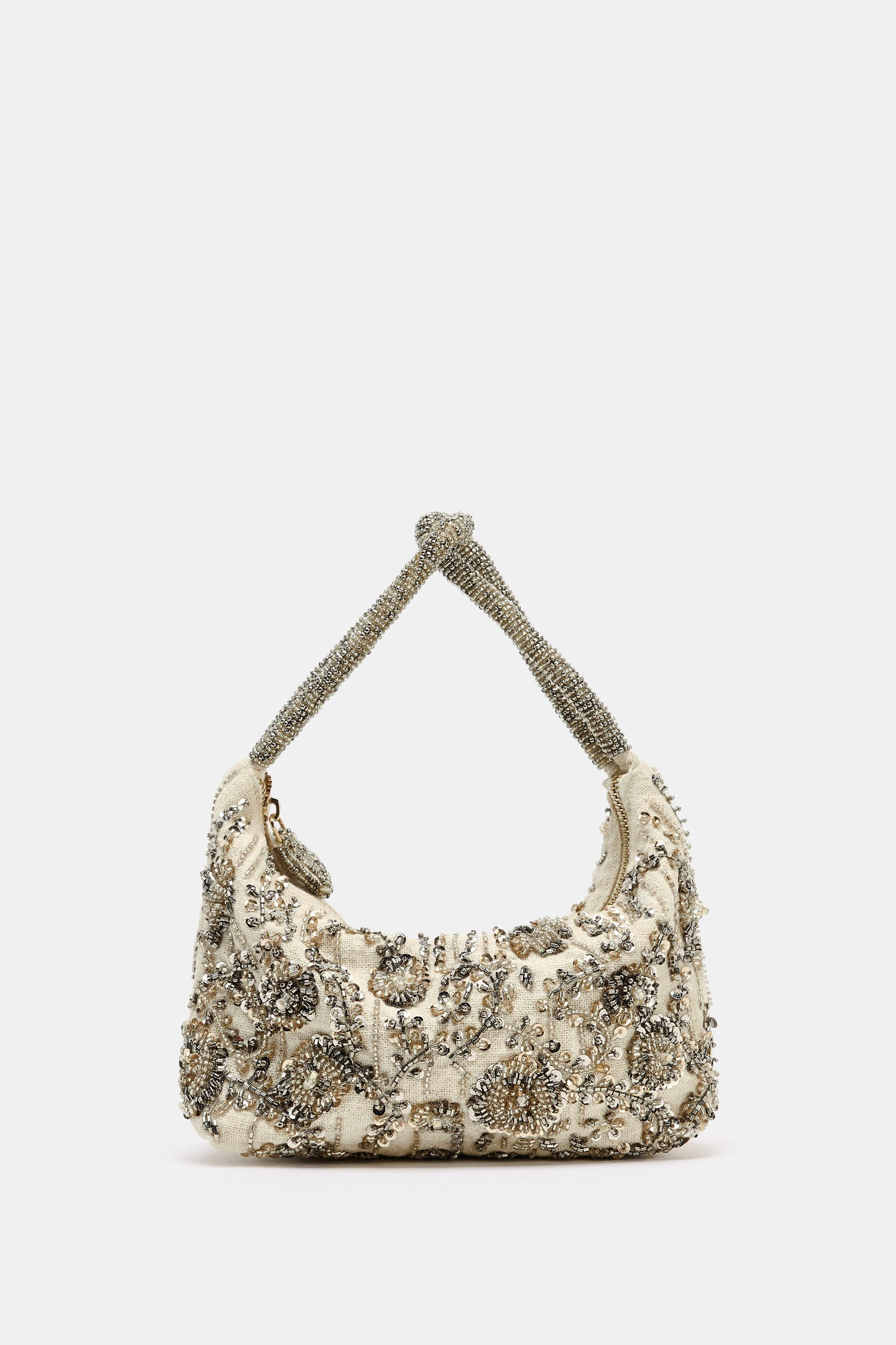Handbag style. Sequin and appliqu\u00e9 fabric exterior. Intertwined hand strap with a beaded bod... | Zara US
