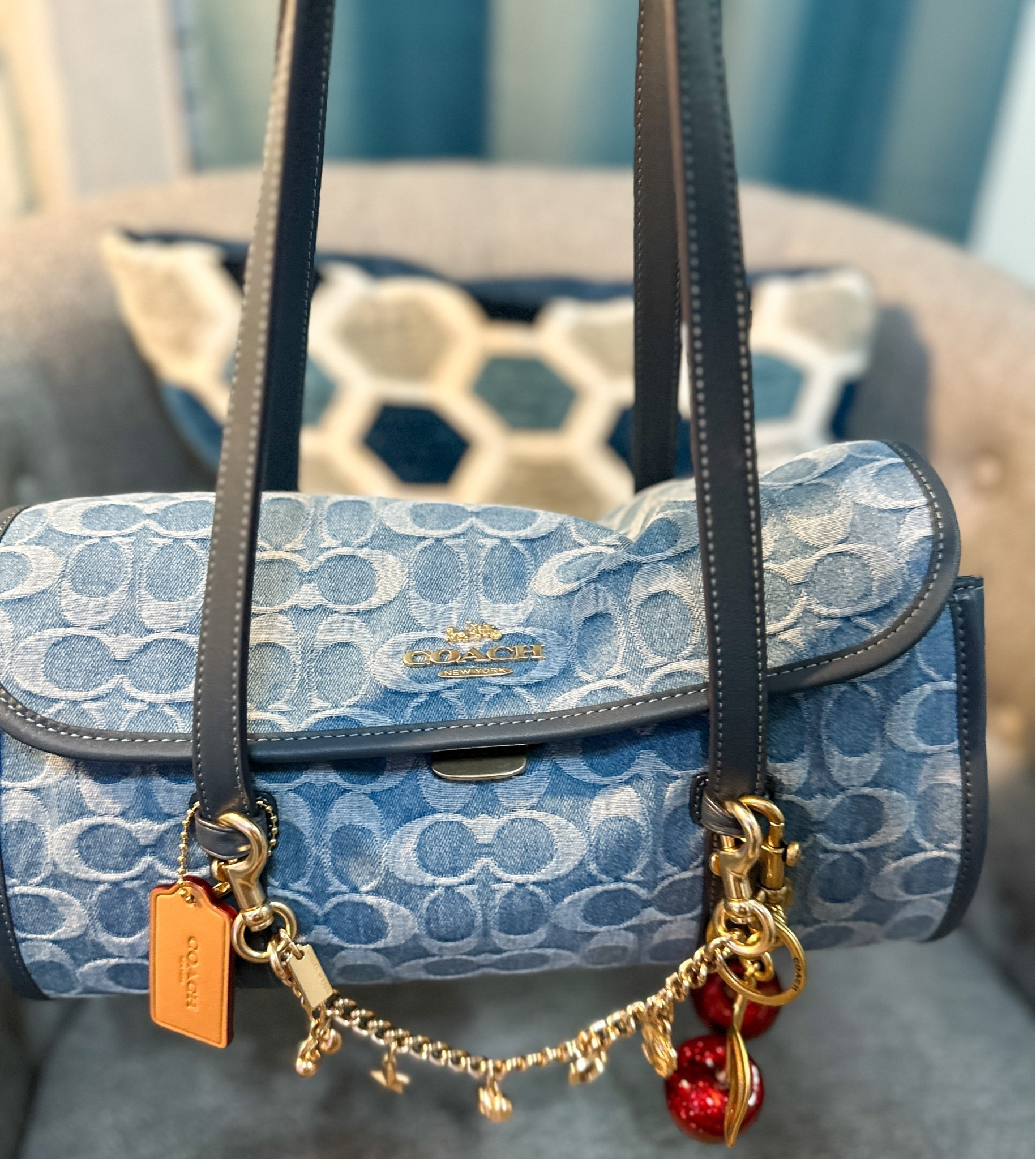 Denim Coach purse with charm chain and cherry charm. Love this handbag with the charms. Denim is perfect for Spring and Summer. #Denim #handbag #purses #Coachpurse #Charms

#LTKMothersDay