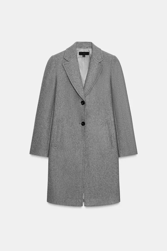 Coat with lapel collar and long sleeves with shoulder pads. Double welt front pockets. Hem with b... | Zara US
