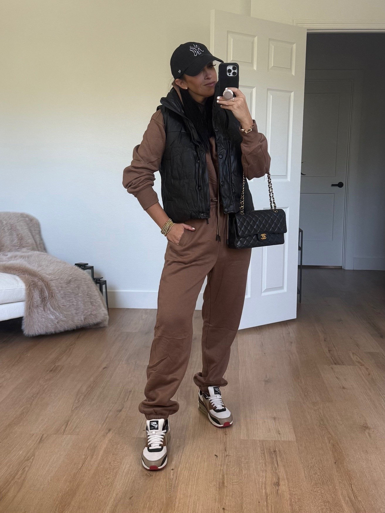 Faux Leather Puffer Vest wearing size small. 2 Piece sweatshirt and pants set wearing size medium. 