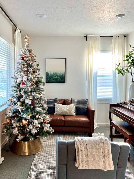 Our flocked tree really makes the living room feel so cozy. Several of these items are on sale for Black Friday!

Christmas tree, vegan leather sofa, armchair, cable knit throw, lit tree topper, disco ball ornament, extra long faux stem, tall vase, woven rug, plaid pillow covers

#LTKSeasonal #LTKHoliday #LTKCyberweek