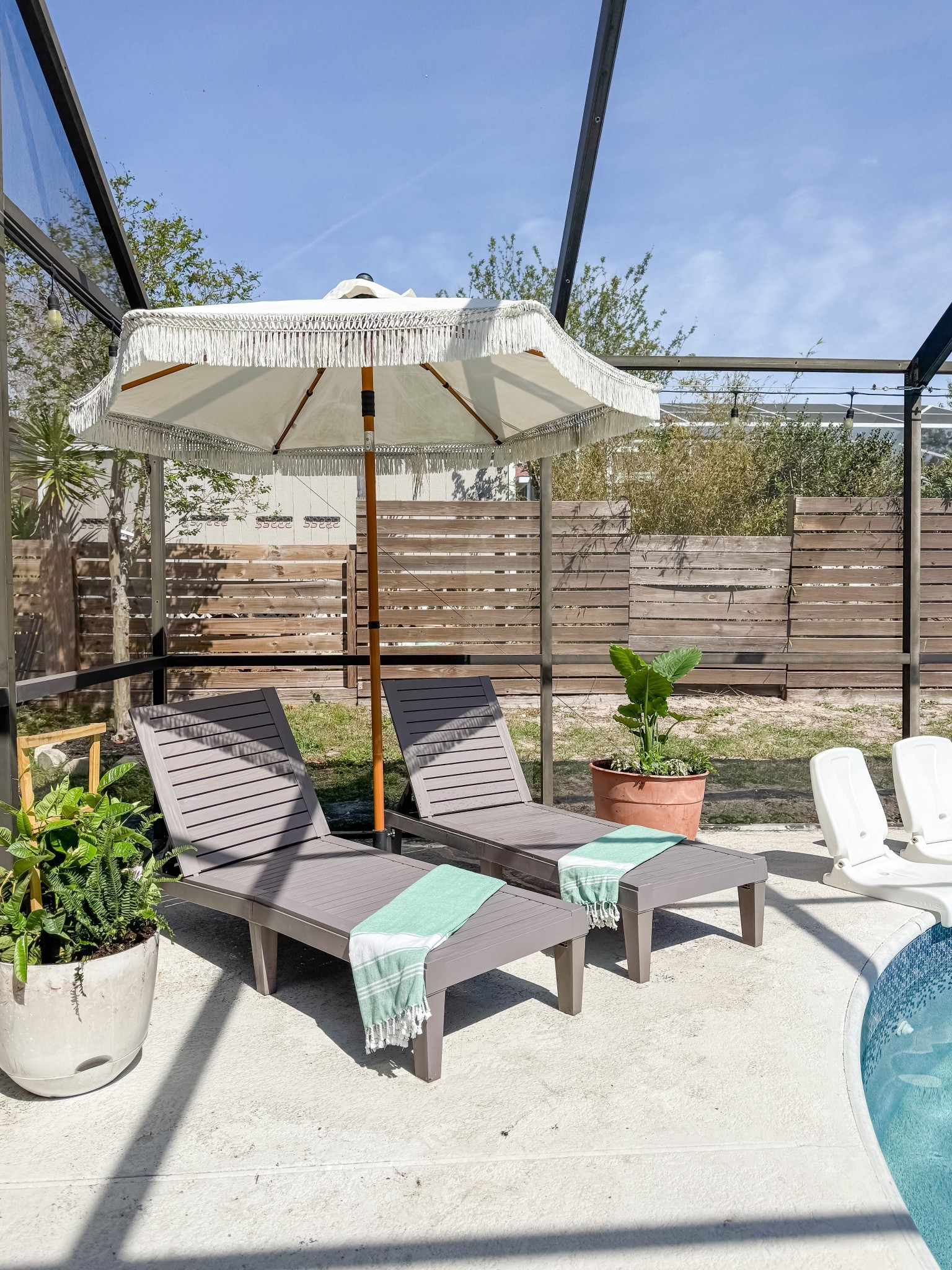 Poolside seating and plants 🪴 

#LTKHome #LTKSeasonal