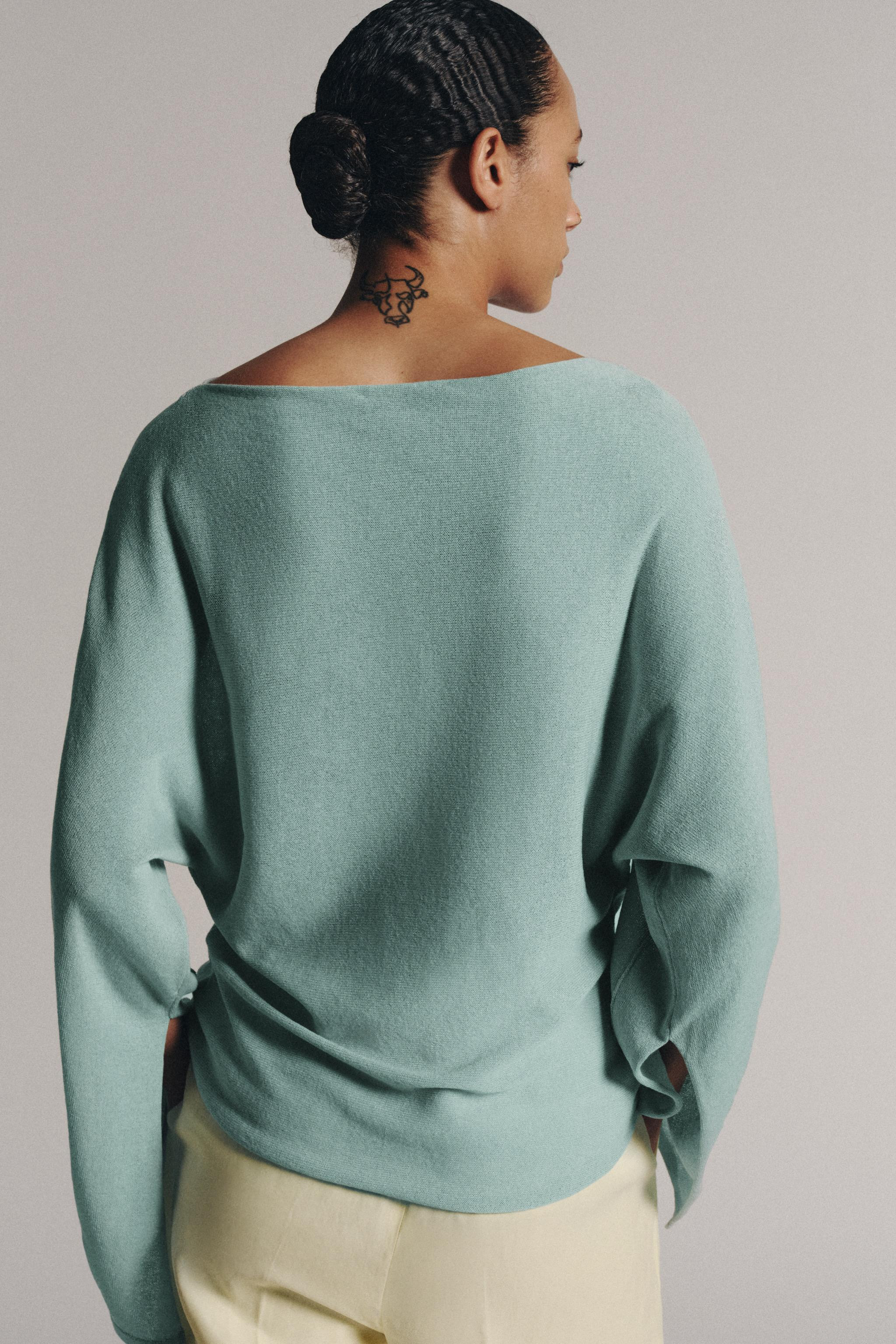 Model height: 178 cmBoat neck jumper. Long sleeves with slits and a wide armhole. Featuring promi... | Zara UK