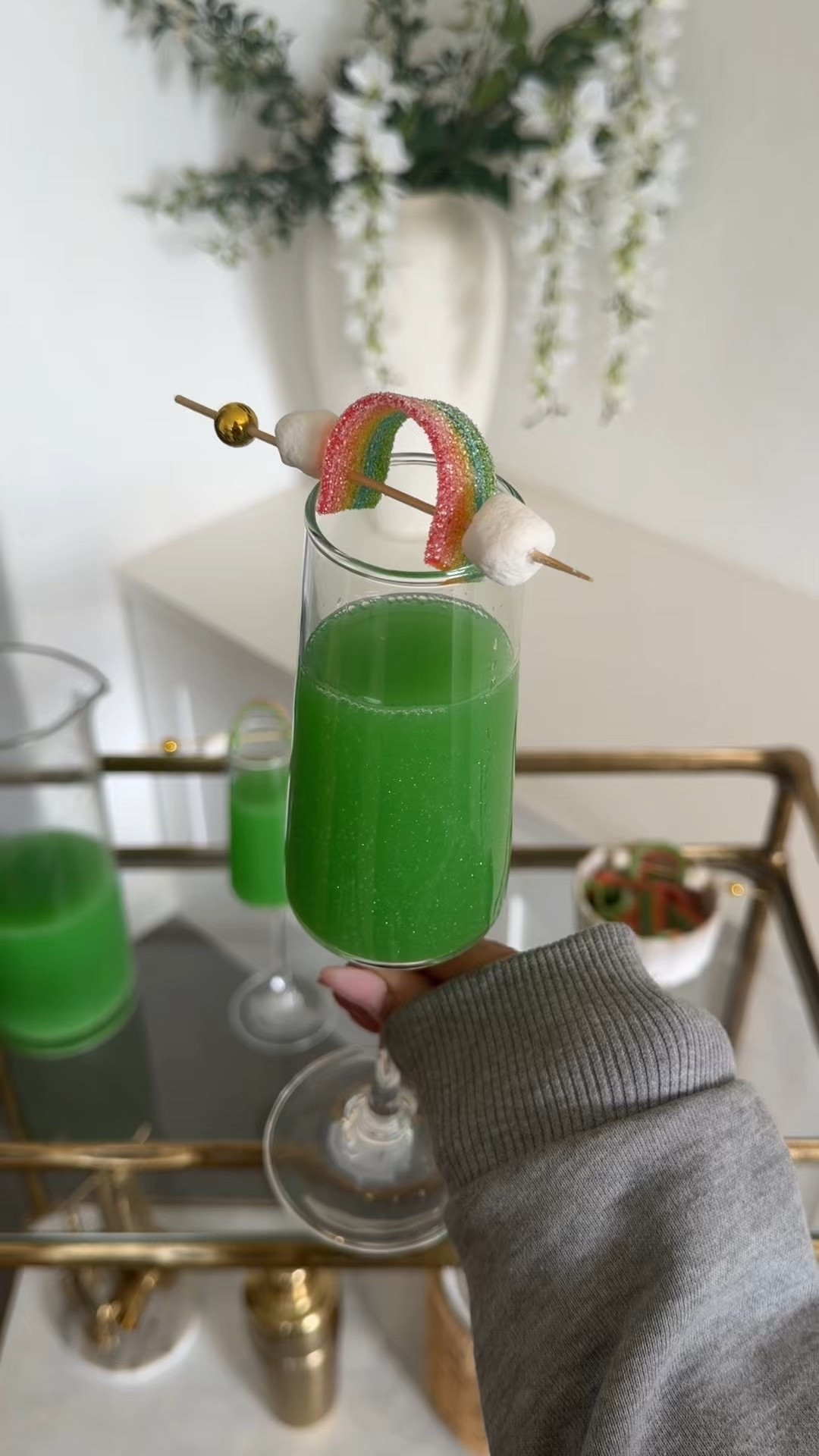 St. Patrick’s Day cocktail 
Green drink 
Mimosa 
Edible glitter 

#LTKSeasonal