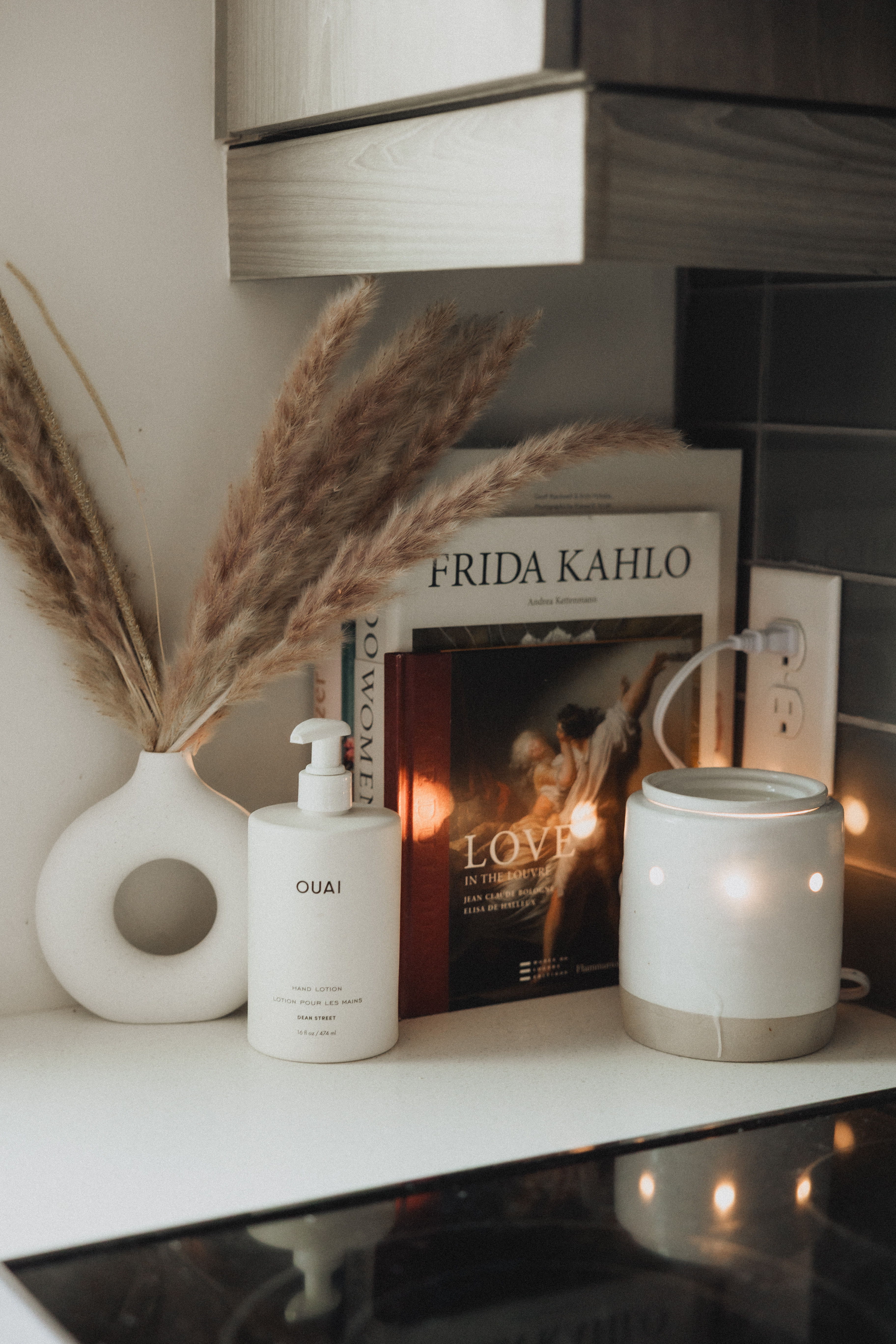 This little kitchen counter setup came together with a few pieces that make the space feel elevated without trying too hard. I love styling with Taschen coffee table books and art books from museums because they add so much character and make the space feel collected over time. Add a candle warmer, a few decorative accents, and the Ouai Hand Lotion, and suddenly an everyday corner feels so much more intentional.

If you're looking for kitchen counter decor ideas, coffee table books for home styling, luxury hand lotion, or chic home accessories, these are the pieces that instantly make a kitchen feel warm, lived in, and beautifully styled.

#LTKdayinmylife #LTKHome #LTKSaleAlert