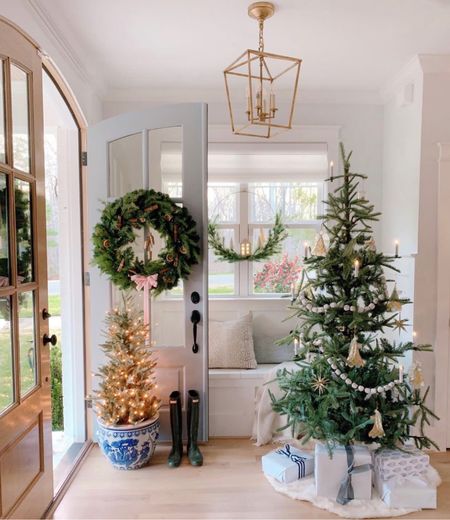 Cozy holiday decor in foyer using a thin Christmas tree, wreath in window and small prelit trees in pots. Use code CHRISSY for discount on wreath!

#LTKSeasonal #LTKunder100 #LTKhome