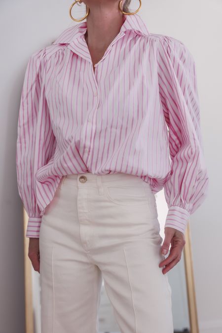 This pink striped blouse is a standout piece because of its fit and details. It's oversized, which is very on-trend right now, and it has a really unique cut at the shoulder complete with feminine puff sleeves. It's also very lightweight, offering coverage but allowing you to stay cool. (True to size.)

~Erin xo 

#LTKstyletip #LTKSeasonal #LTKworkwear