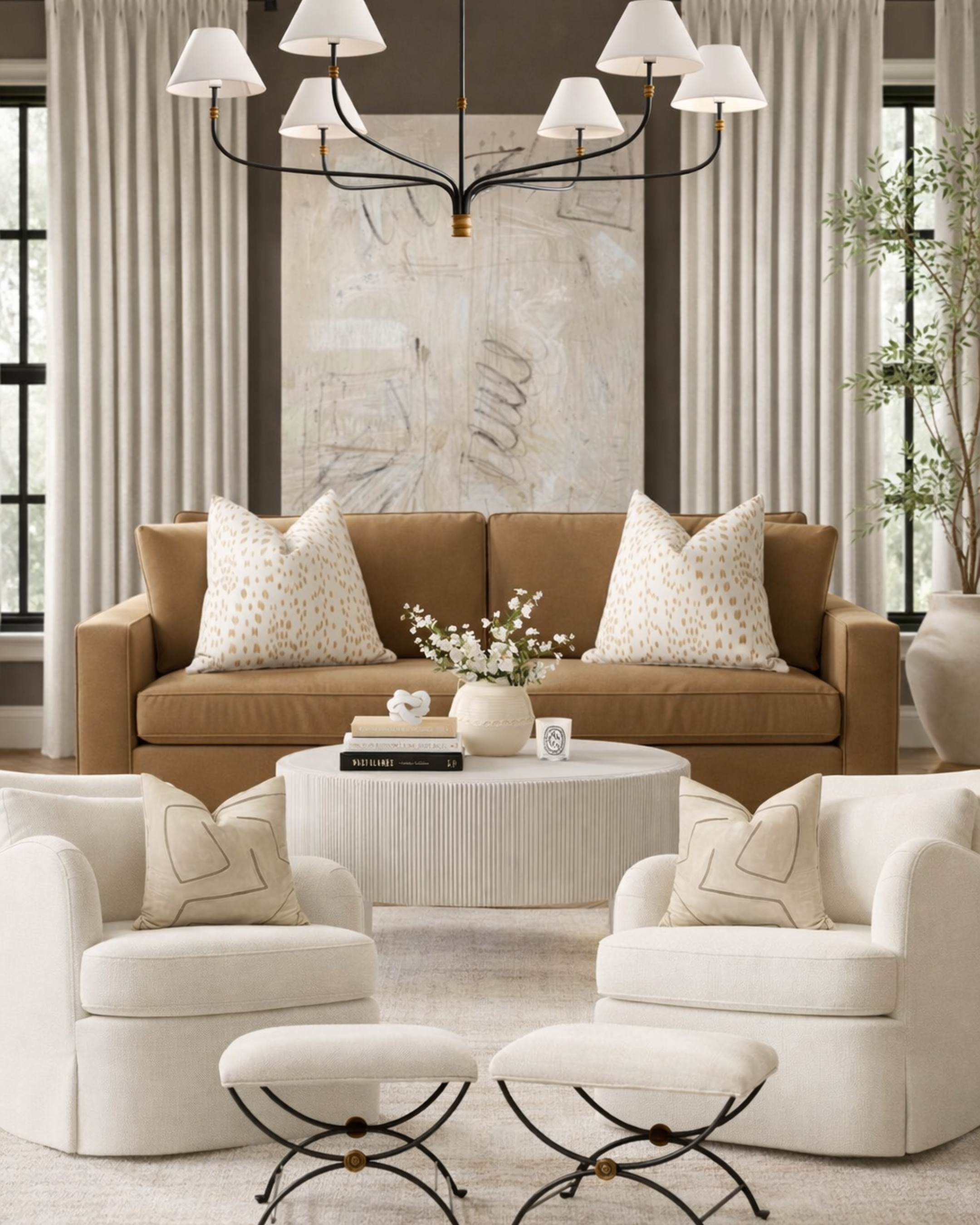 This is what happens when warm neutrals actually have depth.
The camel sofa grounds the entire space while the layered ivories keep it feeling light, not flat. Notice how nothing is overly contrast-heavy—it’s all about subtle variation, texture, and proportion. That’s what makes it feel expensive.
The mix here is doing the work:
 – tailored upholstery + soft curves
 – tonal pillows instead of bold color
 – a statement chandelier that doesn’t overpower
 – warm wood + creamy textiles balancing each other out
It’s calm, but it’s not boring—and that’s the difference most people miss.
If your space feels “blah,” it’s usually not the color… it’s the lack of layering.
Save this as your neutral living room blueprint. 

 #LTKHome