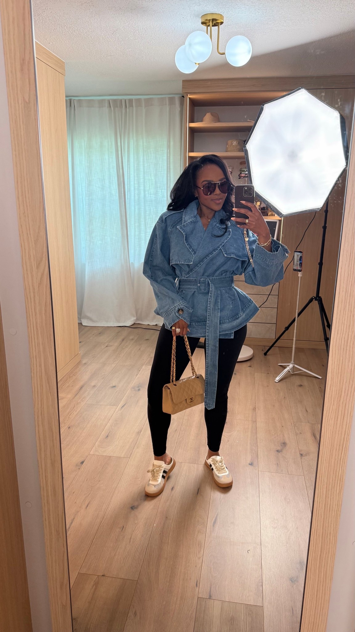 Scroll to shop 🤍  

A sporty-chic everyday look with a belted denim jacket, black leggings, and neutral sneakers — comfortable but still put together.

