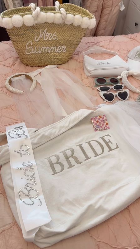 Listen up if you need cute bachelorette accessories!

The custom straw beach bag is from Etsy, headband veil is from Icing, & the bow veil is from Nasty Gal

The rhinestone sash is from xo, Fetti, the terry cloth bag is from Six Stories and the pearl bride necklace is from xo, Fetti

The sparkly veil in the middle is from Amazon, and the 2 on either side of it are from xo, Fetti

The rhinestone purse is from amazon, the white headband is from Target and the bride baseball cap is from Icing

The white rhinestone bride purse and the middle pair of sunglasses are from xo, Fetti, the blue sunglasses are from target and the bottom pearl sunglasses are an amazon DIY!

#LTKtravel #LTKwedding #LTKunder50
