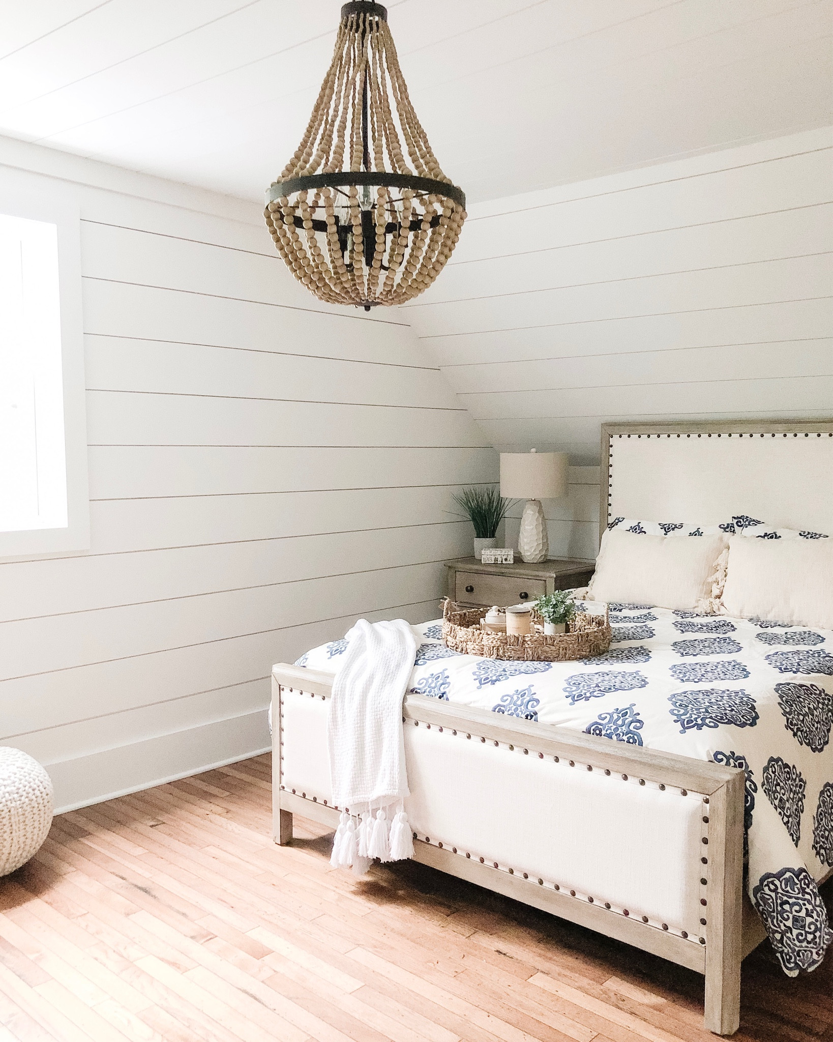 Primary Bedroom Remodel | Blue and White Bedding | Farmhouse Style Decor | Lighting | Wood Bead Chandelier | Table Lamps | Light Fixture | Bedroom Furniture | Upholstered Bed | Nightstand | Duvet Cover | Pouf Ottoman | Lighting

#LTKhome #LTKstyletip