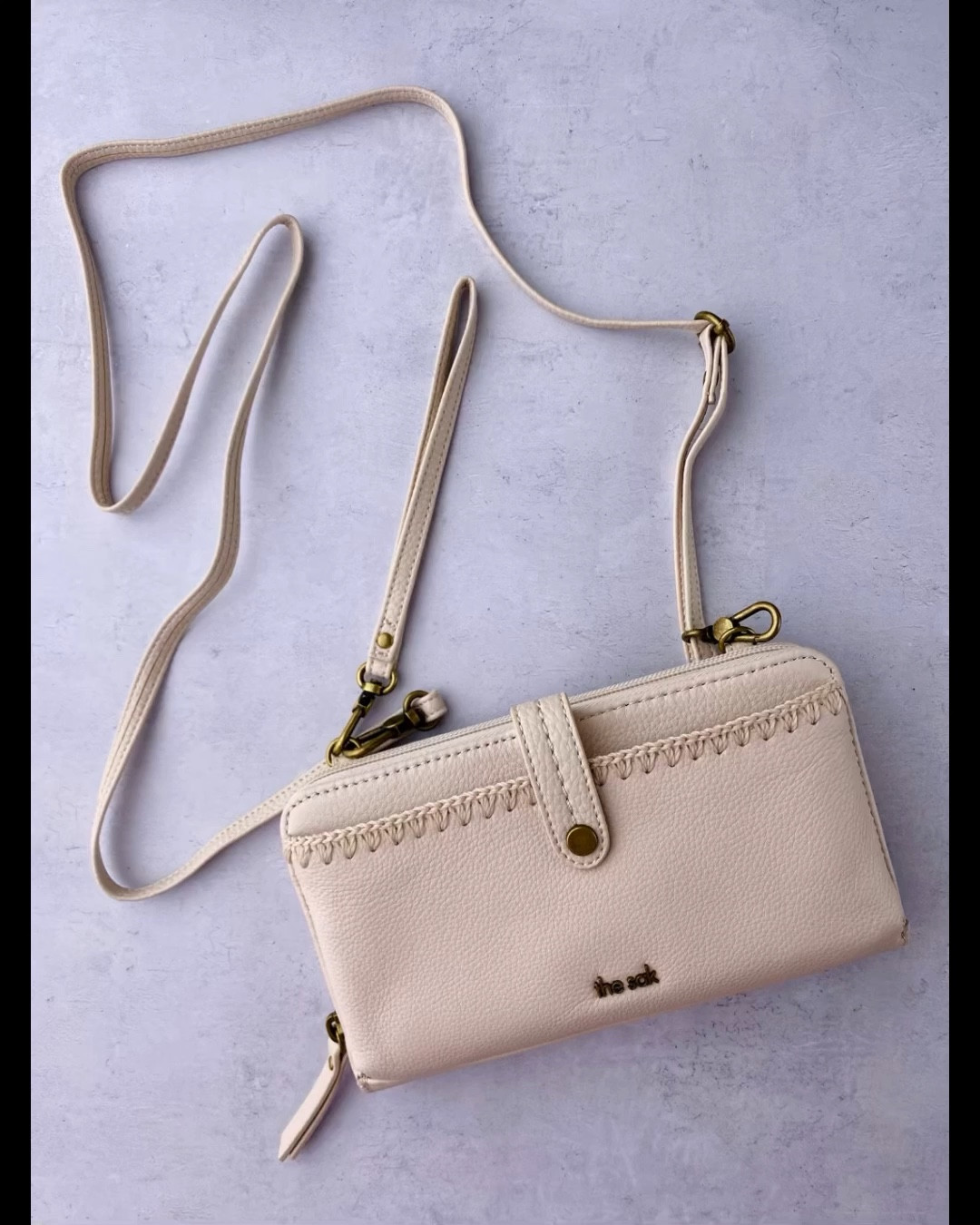 I was looking for a wallet that had space for a cellphone and options for carrying crossbody or wrist that fit in my purse or other larger bags for traveling. The straps are detachable. The zipper works great! In the video was one handed zipper opening because I was videotaping. I love it & hope this helps you! Cute & functional. Great for around town, walks, or travel. 

#LTKTravel #LTKStyleTip #LTKItBag