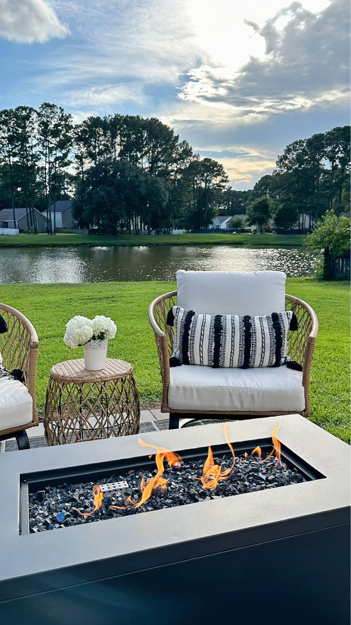Outdoor living space with outdoor furniture and decor from Walmart, smokeless fire pit, wicker outdoor chair and table set, throw pillows

#LTKHome #LTKSaleAlert #LTKSeasonal