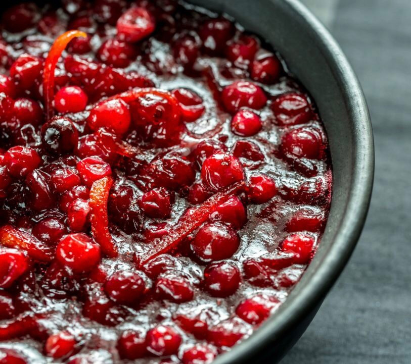 Judi’s Famous Cranberry Sauce

Ingredients:
12oz fresh cranberries
1 3/4 cups sugar
1 Granny Smith apple, peeled, cored, and chopped
1 orange, zest grated and juiced
1 lemon, zest grated and juiced
3/4 cup chopped walnuts or pecans

Directions:
Cook the cranberries, sugar, and 1 cup of water in a saucepan over low heat for about 5 minutes, or until the skins pop open.
Add the apple, zests, and juices and cook for 15 more minutes.
Remove from the heat and add the raisins and nuts.
Let cool, and serve chilled.