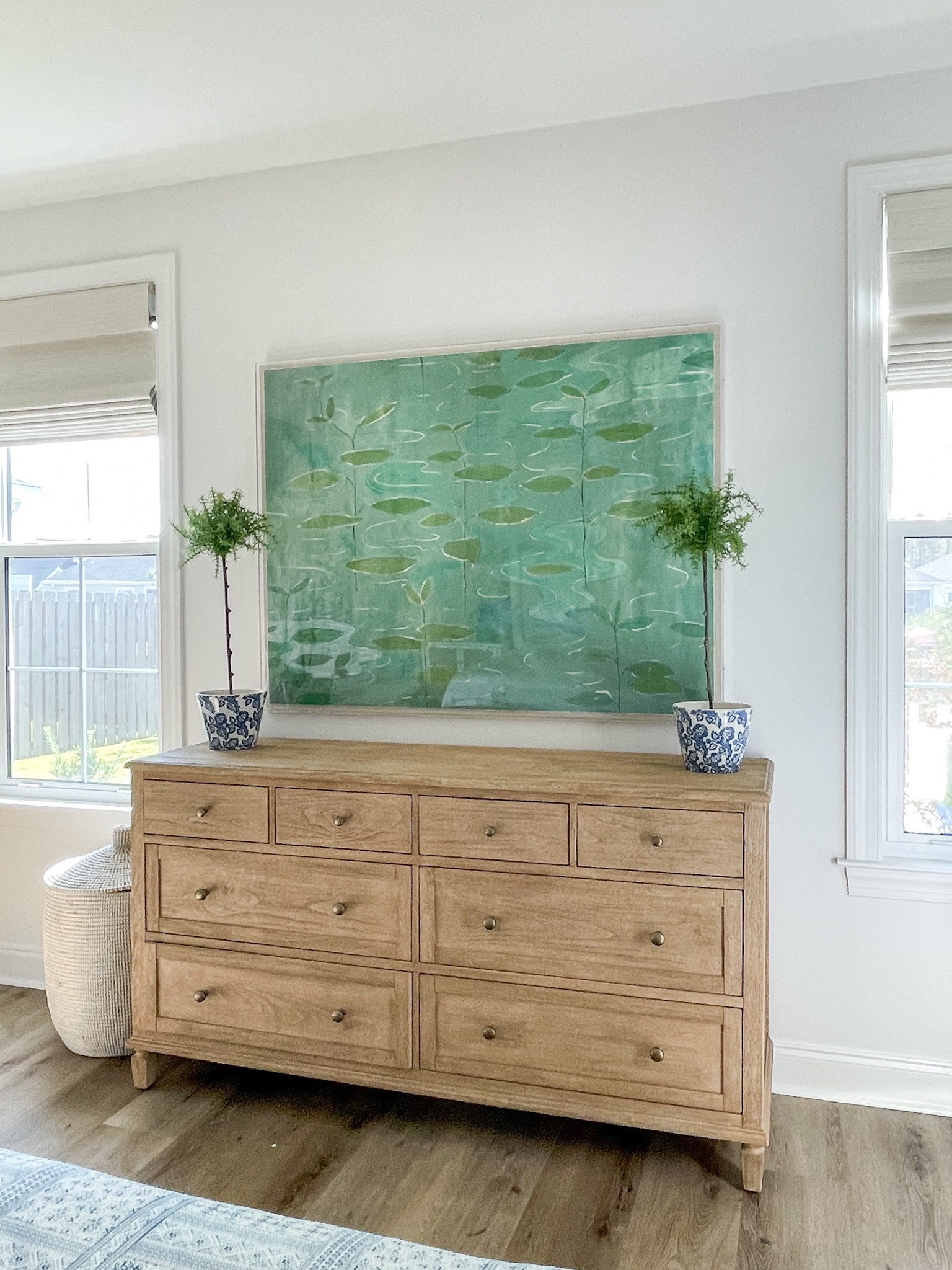 Loving how our primary bedroom is coming together in Florida! We’re using our light wood dresser that we’ve loved for years, but added this new gesso white chandelier, lily pad art, and woven basket hamper. Also linking our white upholstered bed, batik bench, rattan nightstands and blue gray lamps. 

. coastal master bedroom, green and blue bedroom decor, dresser styling ideas

#ltkhome #ltksalealert #ltkunder100 #ltkunder50 #ltkstyletip #ltkseasonal #ltkfamily  

#LTKhome #LTKunder100 #LTKsalealert #LTKSeasonal #LTKhome #LTKsalealert