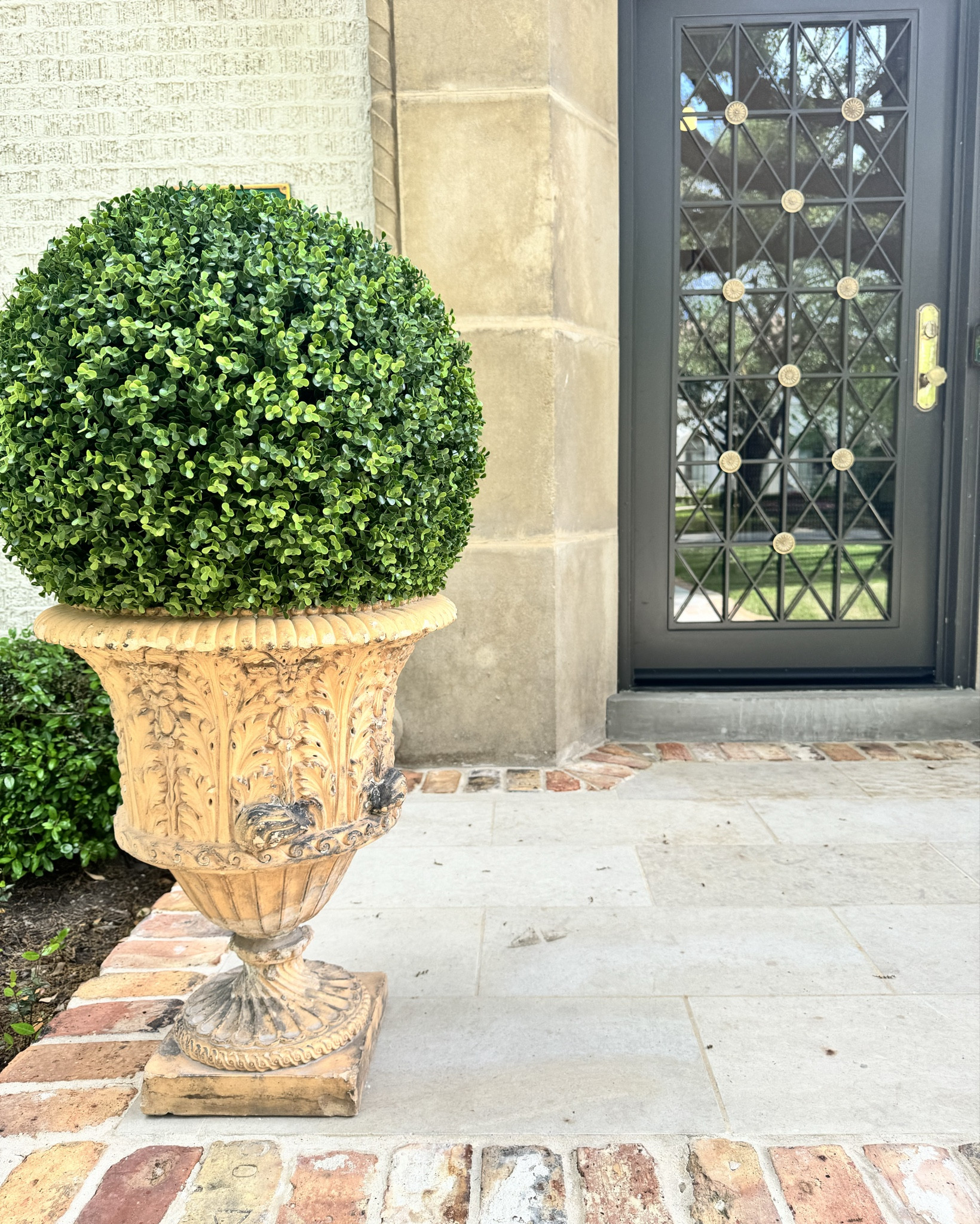 We love these boxwood planter fillers. No mess and no maintenance! The 21” size is shown here, the urns are about 20” in diameter. Order slightly larger than your container size. You literally just set them in place! These look real and we keep adding more of them to pots and patios around our home. Because they are so easy to remove you can also change things up seasonally, think lit trees at Christmas or pumpkins at Halloween. Seriously, these boxwood accents are the easy upgrade you’ll make to your outdoor space all year.

#LTKSeasonal #LTKhome