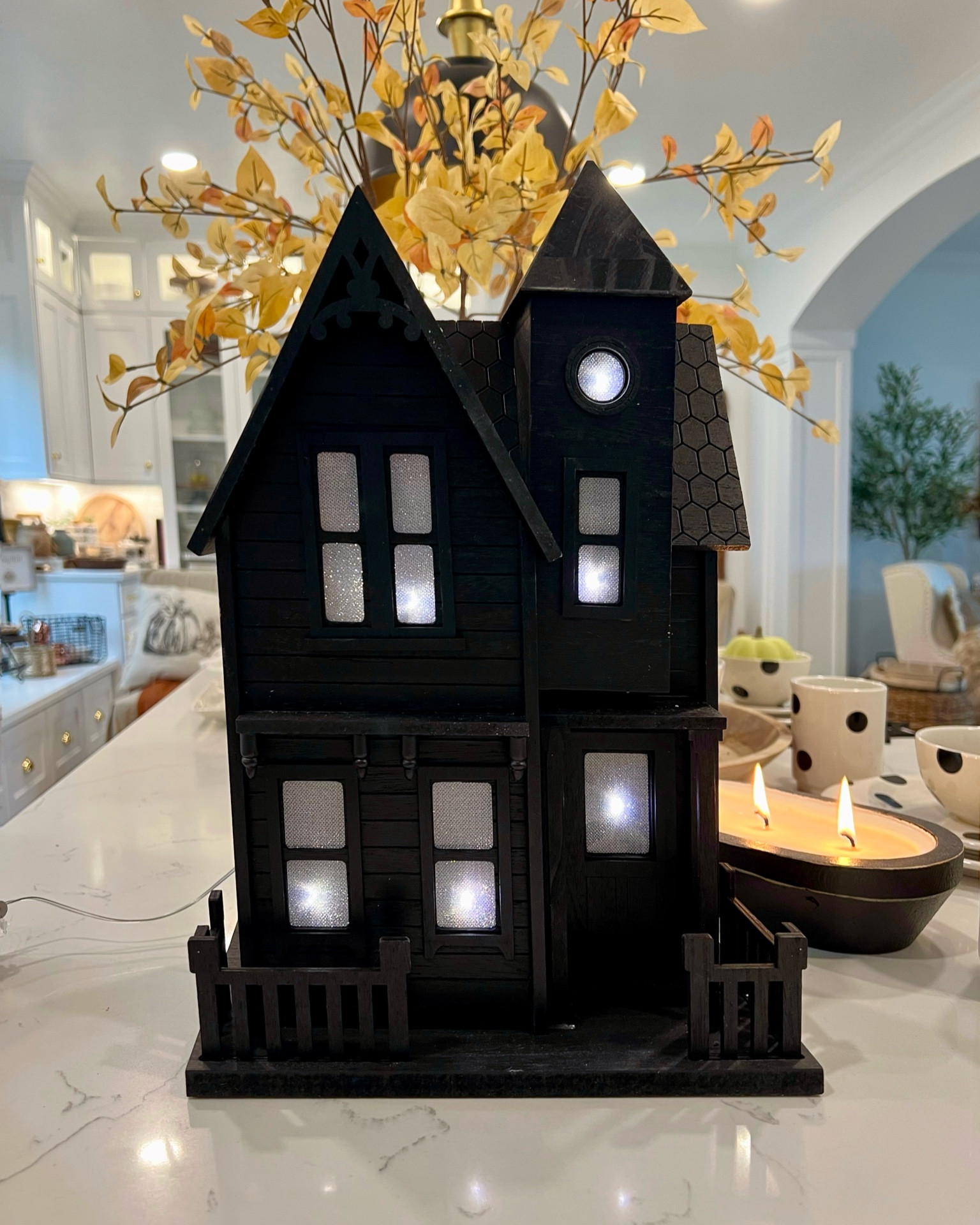 Darling black haunted house for Halloween Decor. Lit with a battery in the back. Several sizes 

#LTKHome #LTKFallSale #LTKSeasonal