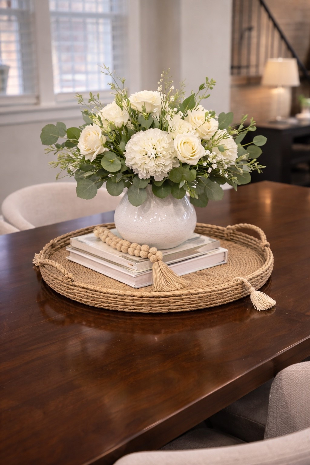 My favorite neutral dining table centerpiece 🤍

I love keeping our dining table simple but cozy. A woven tray, a stack of books, a soft floral arrangement, and a few natural textures instantly make the space feel warm and styled without being too busy.

These are some of my favorite pieces that help create an effortless everyday table look. Perfect for keeping the dining area beautiful but still practical for daily life.

Everything I used for this look is linked here in my LTK!#LTKSpringSale 

#LTKHome #LTKOver40