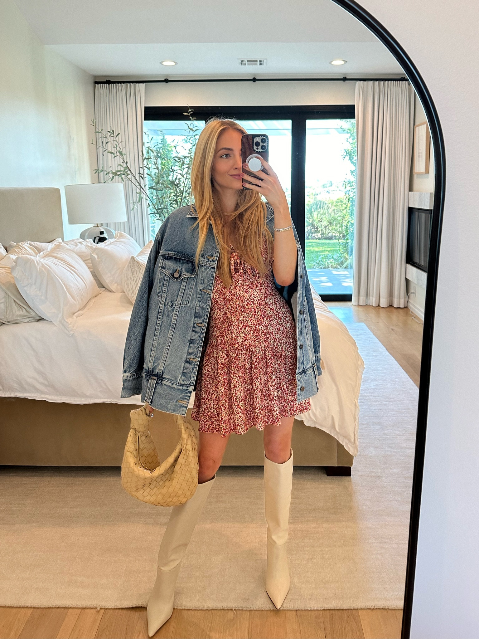 Midweek lunch date on a hot day - rewearing this red floral Reformation dress I bought for the honeymoon in Paris with my Khaite denim jacket, new Larroude ivory knee high boots (SO comfortable - the foot bed is padded - why don’t all designers do this?!) and Bottega Jodie bag. 

Sizes worn here:
Dress XS (TTS)
Jacket XS (extremely oversized)
Boots 9 (TTS)

#LTKitbag #LTKstyletip #LTKshoecrush