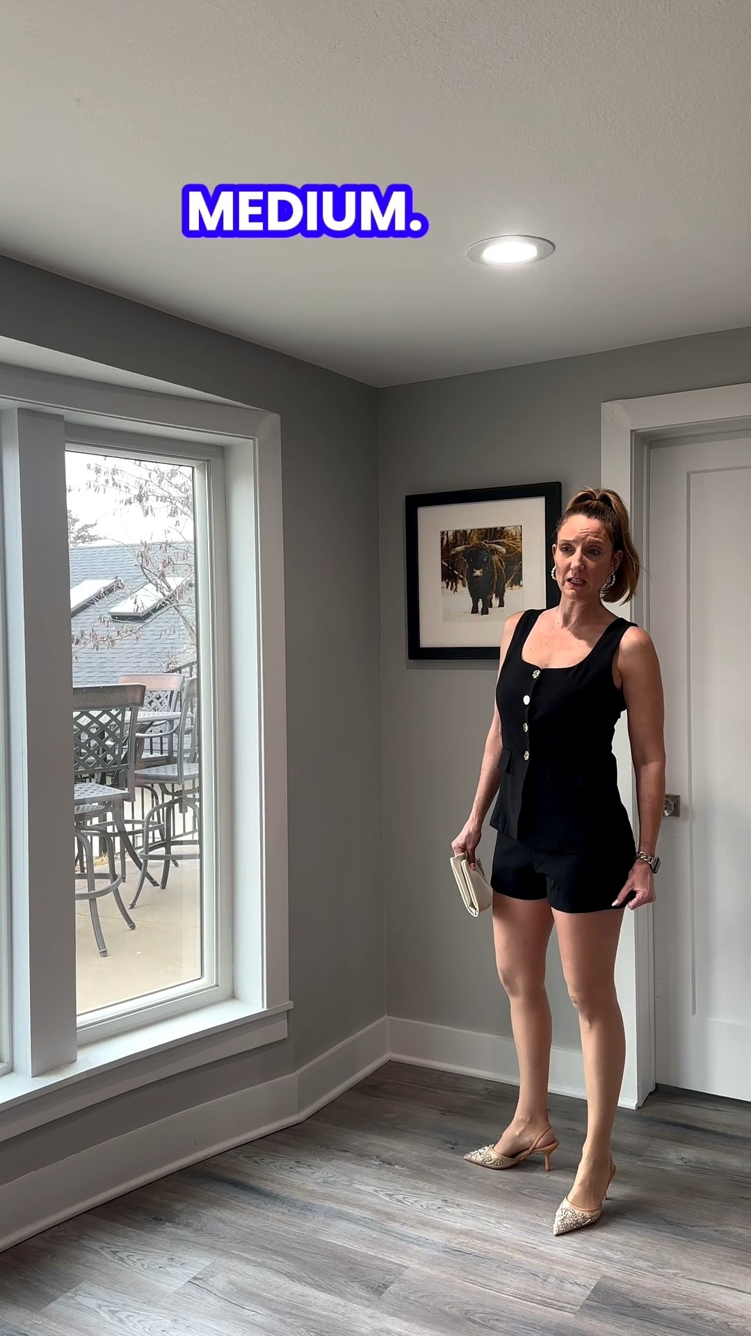 If you’re looking for a sign to try a vest and shorts combo, this is it. 🕊️🧥 I love the clean, monochromatic line of this black sleeveless vest. Pairing it with lace pumps adds just the right amount of 'extra' texture to keep the look interesting. It’s all about those small, intentional luxuries! Tap the link in my bio to snag this look. 🌟👜 #StyleInspo #MonochromeAesthetic #PolishedCasual #LTKfind

A structured sleeveless vest and short set in classic black is a sophisticated choice for a polished, yet playful ensemble. The gold button detailing provides an intentional pop of shine that elevates the look for any social afternoon.
My Tailored Vest & Short Style Breakdown
• The Hero Piece: I am wearing a black sleeveless vest featuring large gold statement buttons down the front.
• The Silhouette: The vest has a tailored fit with functional front pockets, creating a structured and professional line.
• The Bottoms: I paired the vest with matching black tailored shorts, creating a chic, monochromatic set that feels completely intentional.
• The Accessories: I finished the look with pointed-toe lace pumps and a cream-colored oversized clutch for a sophisticated contrast. @VICI 

Black sleeveless tailored vest, black tailored shorts for women, pointed-toe lace pumps, cream-colored envelope clutch, vest and shorts matching set, gold button fashion, feminine professional style, intentional wardrobe pieces, modern capsule wardrobe, LTKstyle, @VICI  dolls

#LTKTravel #LTKSeasonal #LTKootd

#LTKootd #LTKOver40
