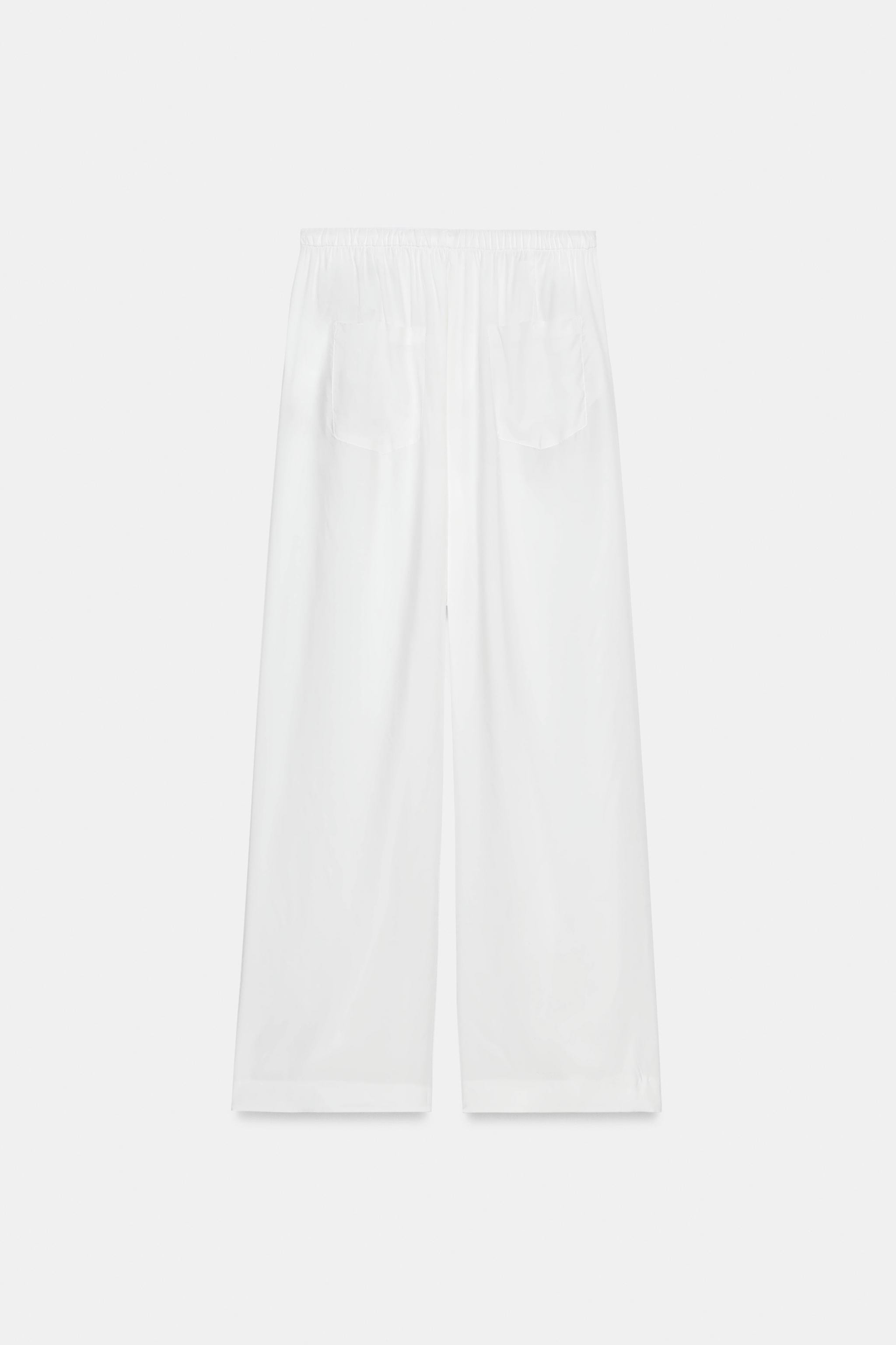 Model height: 176 cmZARA WOMAN COLLECTIONTrousers made from a viscose blend yarn. Mid-waist with ... | Zara UK