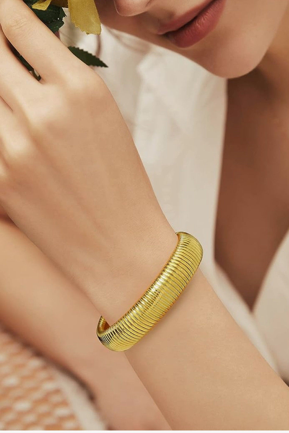 Loving this gold coil bracelet in trend and elevates an outfit 

#LTKstyletip #LTKover40 #LTKFind