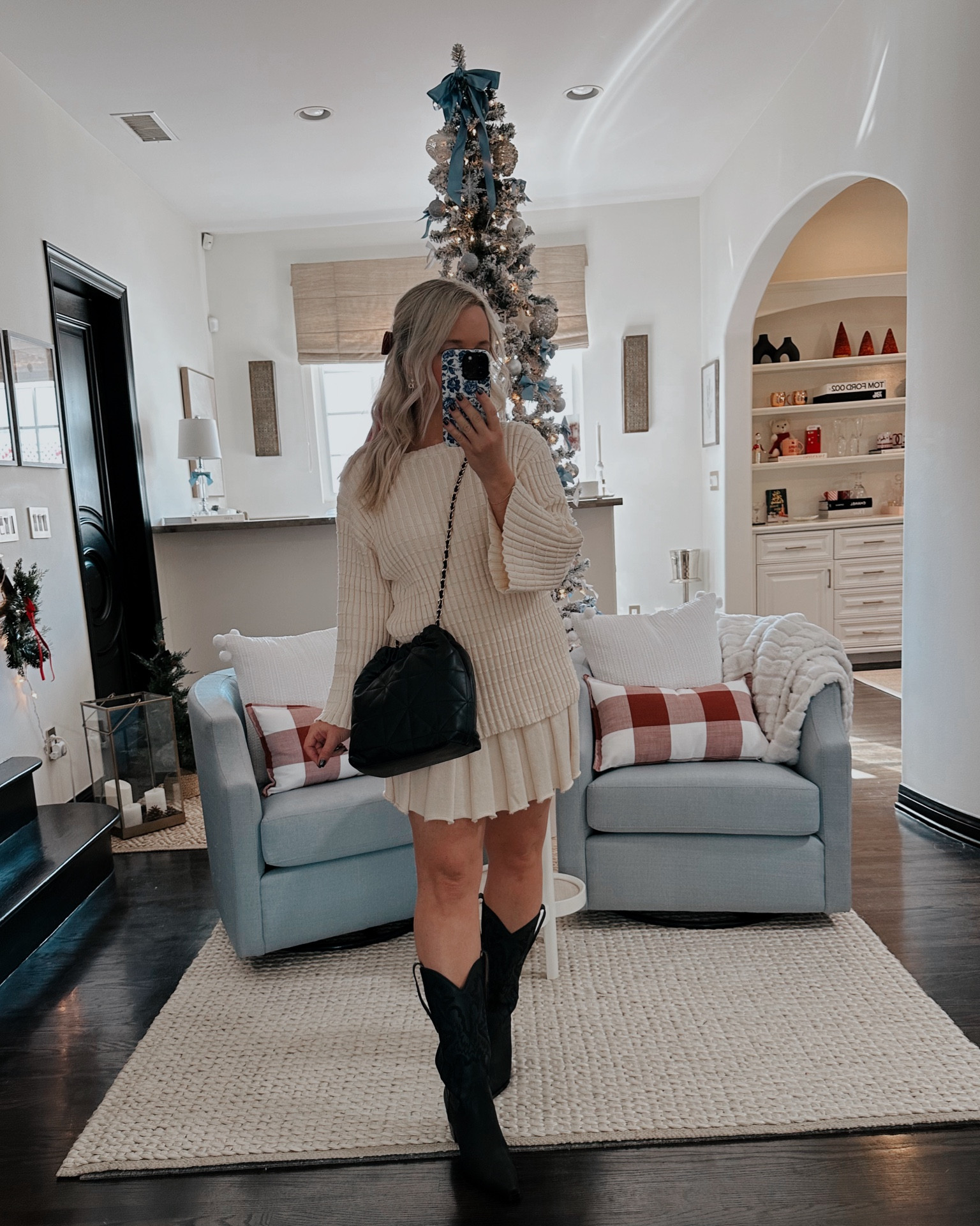 🖤Holiday outfit that can be worn into spring 
🖤Skirt and sweater set are amazon finds, similar to the free people set. if you’re in between sizes, recommend go up 
🖤Black cowboy boots tts
🖤Black chain handbag fits so much, looks so similar to more expensive 
🖤Red organza bow

holiday outfit, holiday style , thanksgiving outfit 

#LTKShoeCrush #LTKHoliday #LTKParties