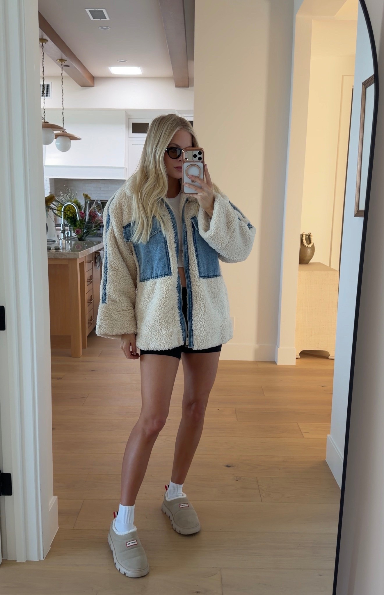 Small in top, small in jacket, 6 in shorts - sized up for bump. True size in shoes 