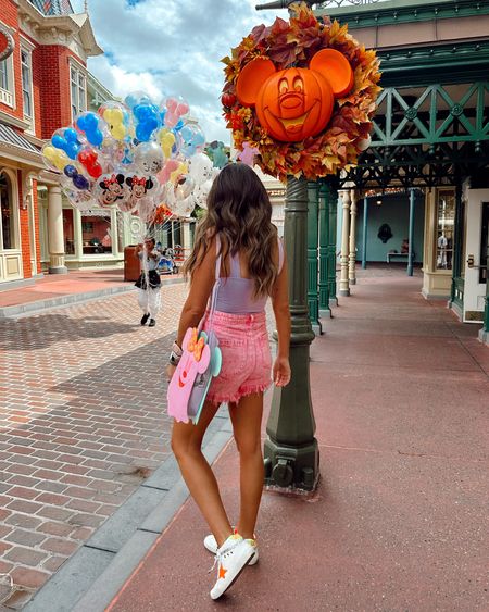 In a small bodysuit, size 29 pink denim shorts, Mickey ghost bag, Mickey Minnie ghost ears, GG sneakers for Disney world outfit - fits TTS.

#LTKstyletip #LTKtravel #LTKHalloween