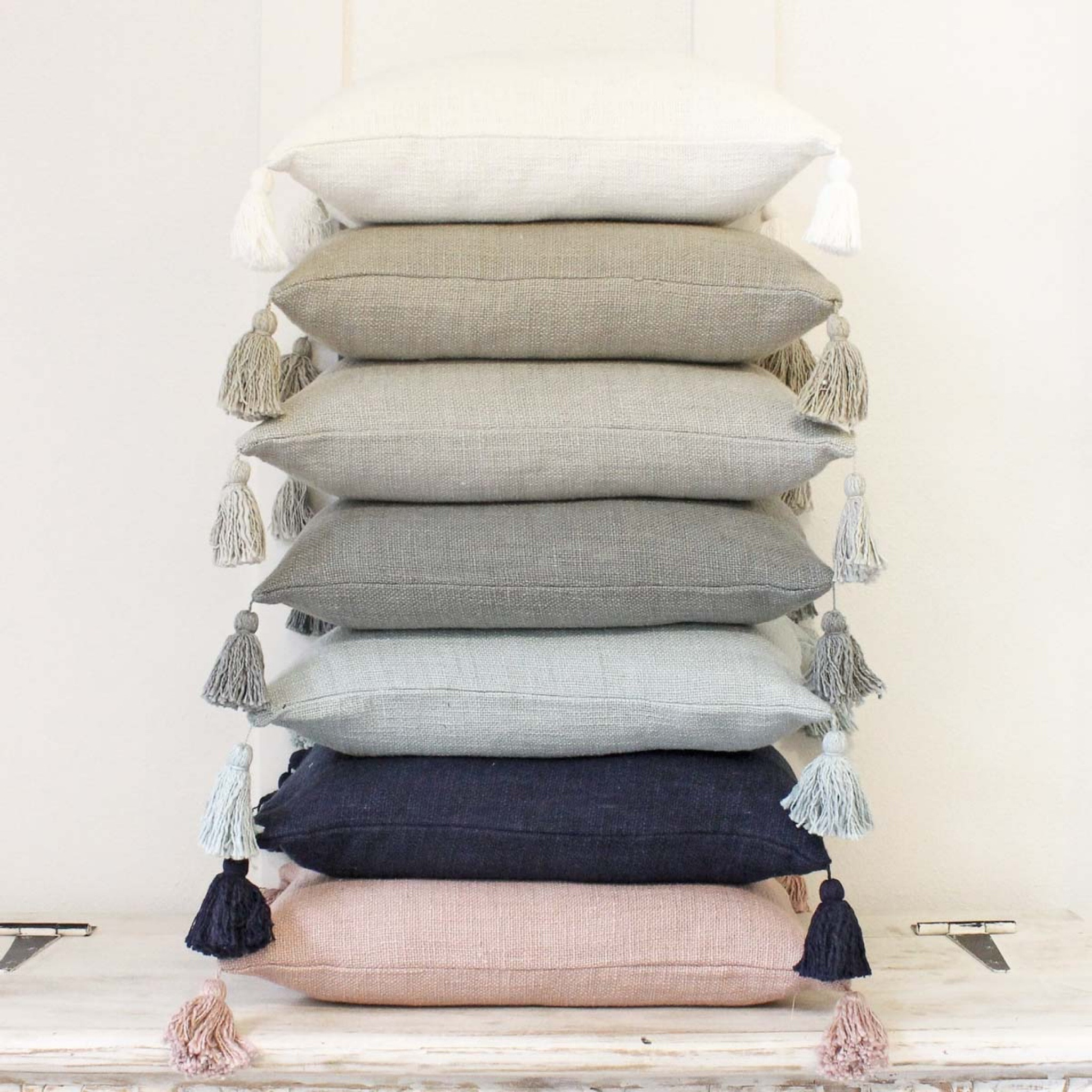 I love these tassel pillow covers! They come in the prettiest colors and are perfect for mixing with patterned pillows.  living room decor, home decor ideas, pillow covers 

#LTKfindsunder50 #LTKfindsunder100 #LTKhome