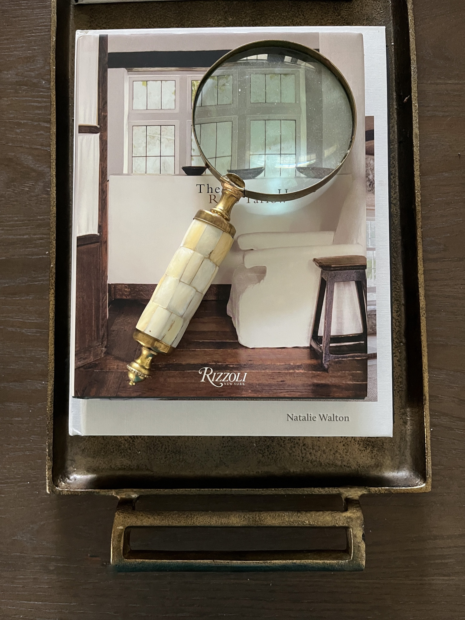 Coffee table book stack with vintage magnifying glass 

#LTKstyletip #LTKhome #LTKfindsunder50