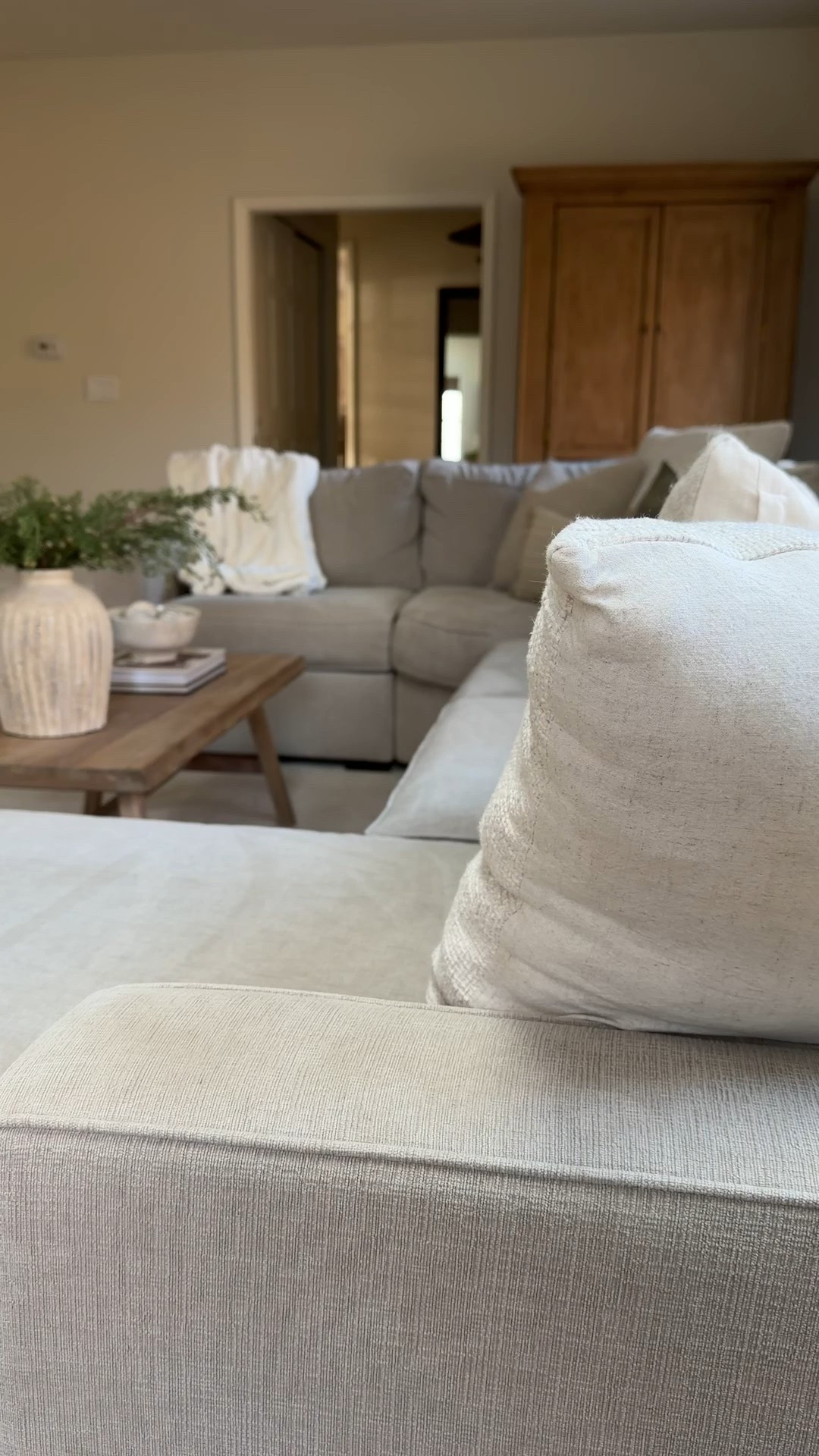 Neutral sectional, Christmas coffee table decor 

#LTKHome #LTKHoliday