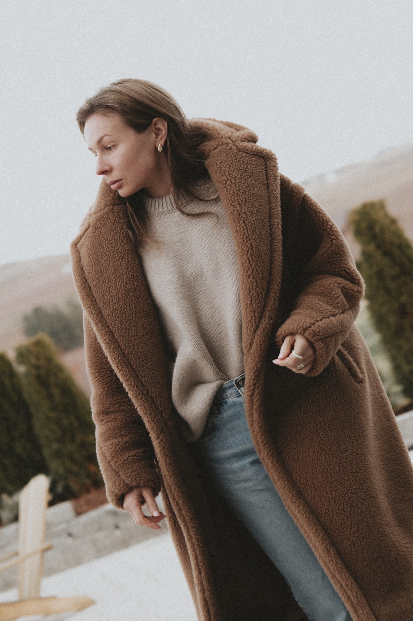 Teddy coat + straight leg jeans + crew neck sweater. 
Statement earrings. 