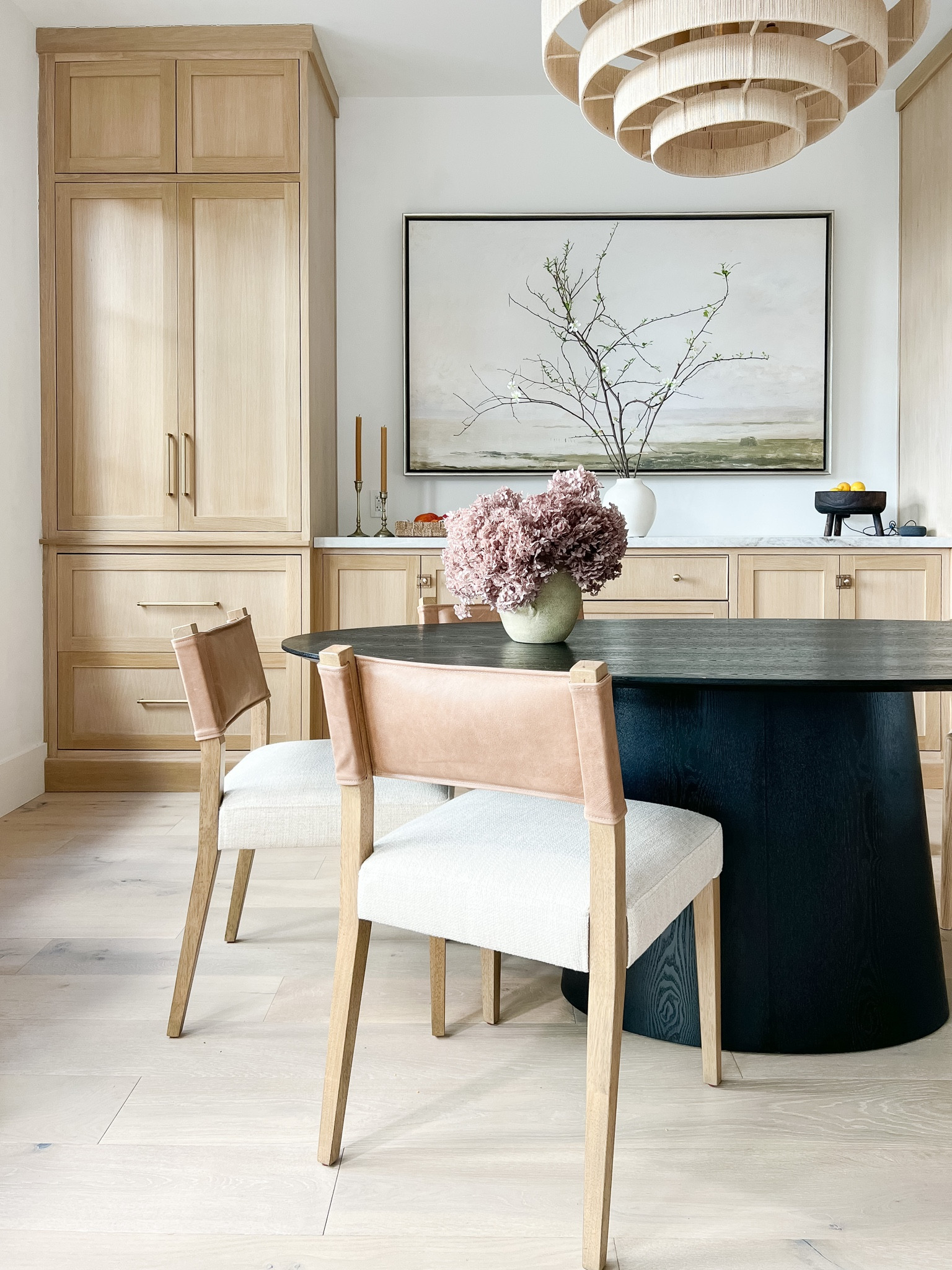 Oval dining table, black dining table, upholstered dining chair, fake flowers, dried hydrangeas, leather chairs, chandelier, rattan chandelier, abstract art, landscape art

#LTKsalealert #LTKhome #LTKCyberWeek