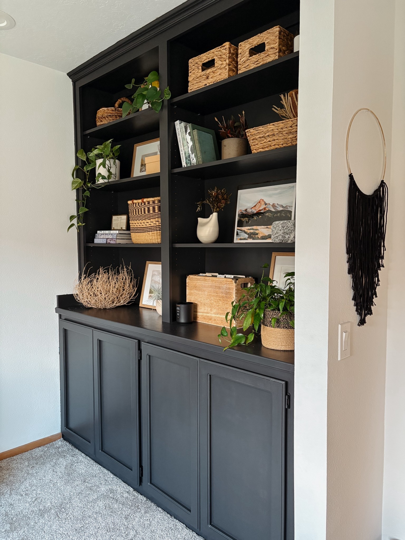 Finally finished! Painted these bookshelf, built-in a dark, warm, black and styled with lots of plants, texture shapes, and curated special pieces. 

#LTKHome