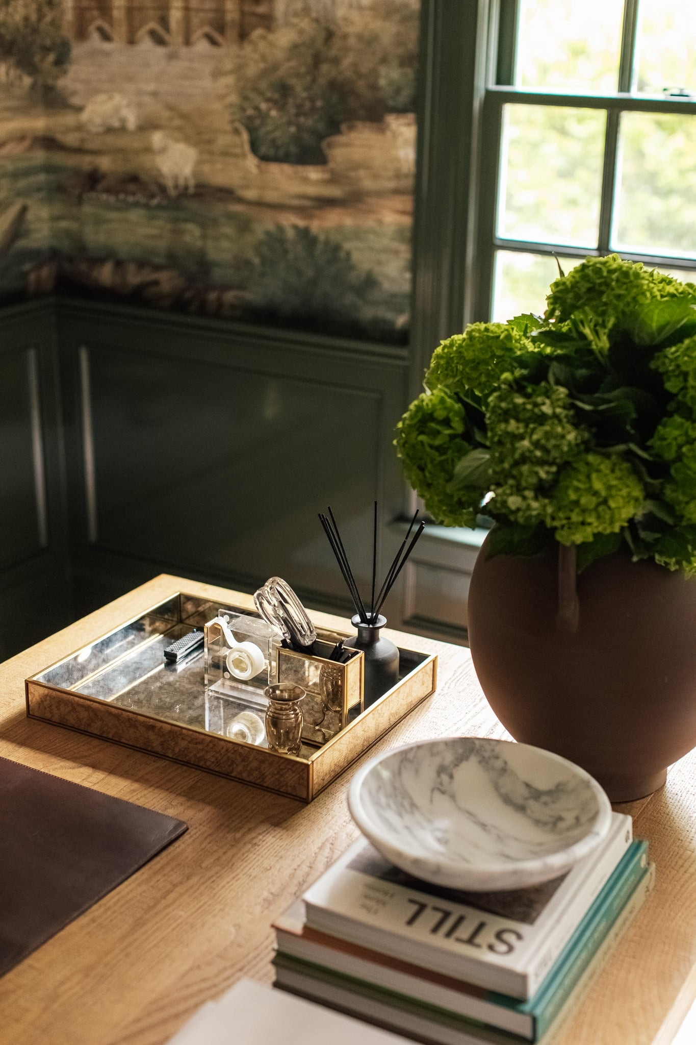 Our desk in the study is actually a dining table! This mirrored tray holds our desk essentials because the desk doesn’t have drawer storage.

#LTKfamily #LTKhome
