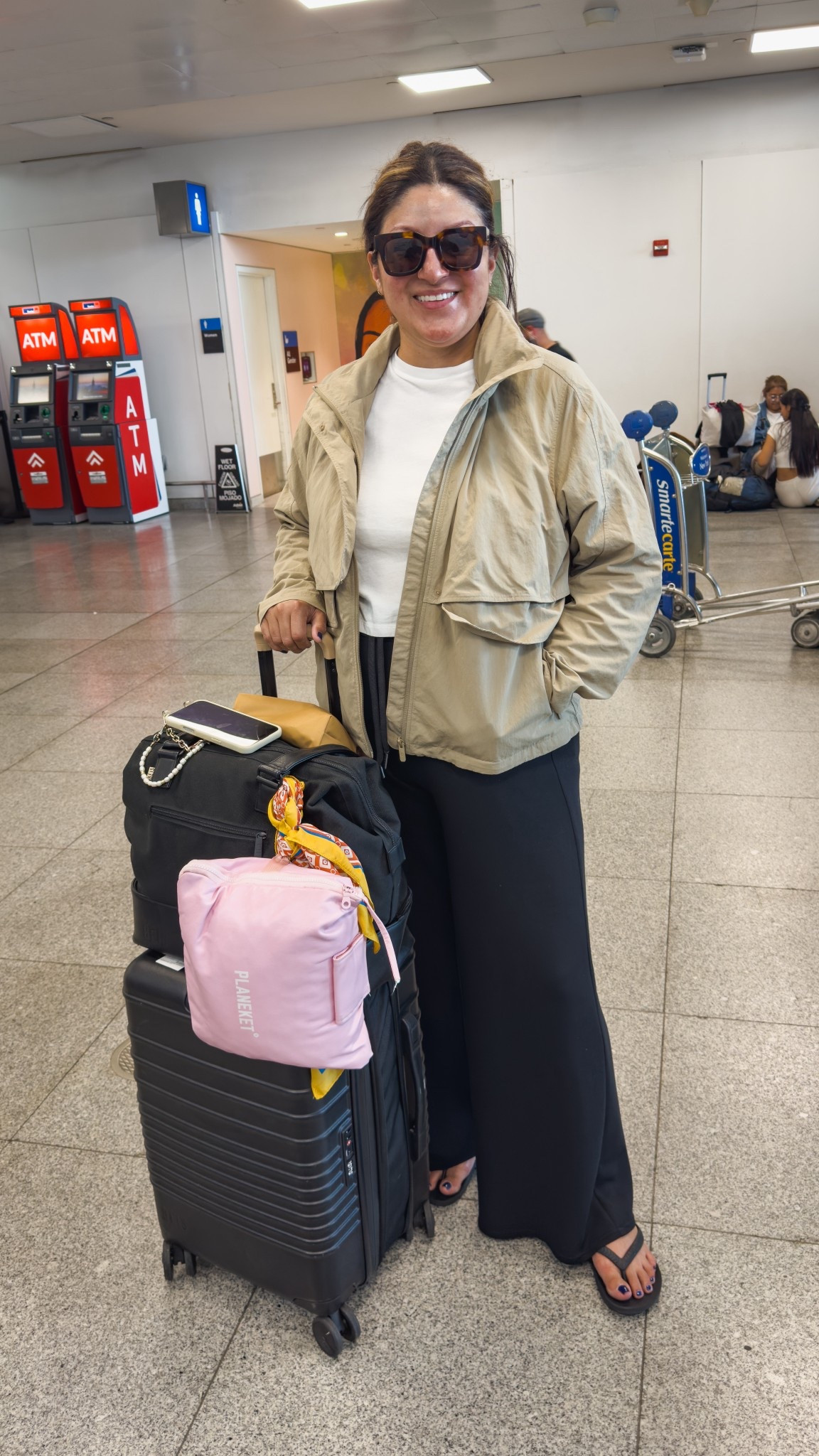 From Florence ➡️ NYC: here’s what I wore on the long trek to the states:
Lululemon jacket (14)
Madewell boxy tee (XL)
Spanx AirEssential wide leg pants (XL)
Archies flip flops 
Beis luggage 

#LTKOver40 #LTKMidsize #LTKTravel