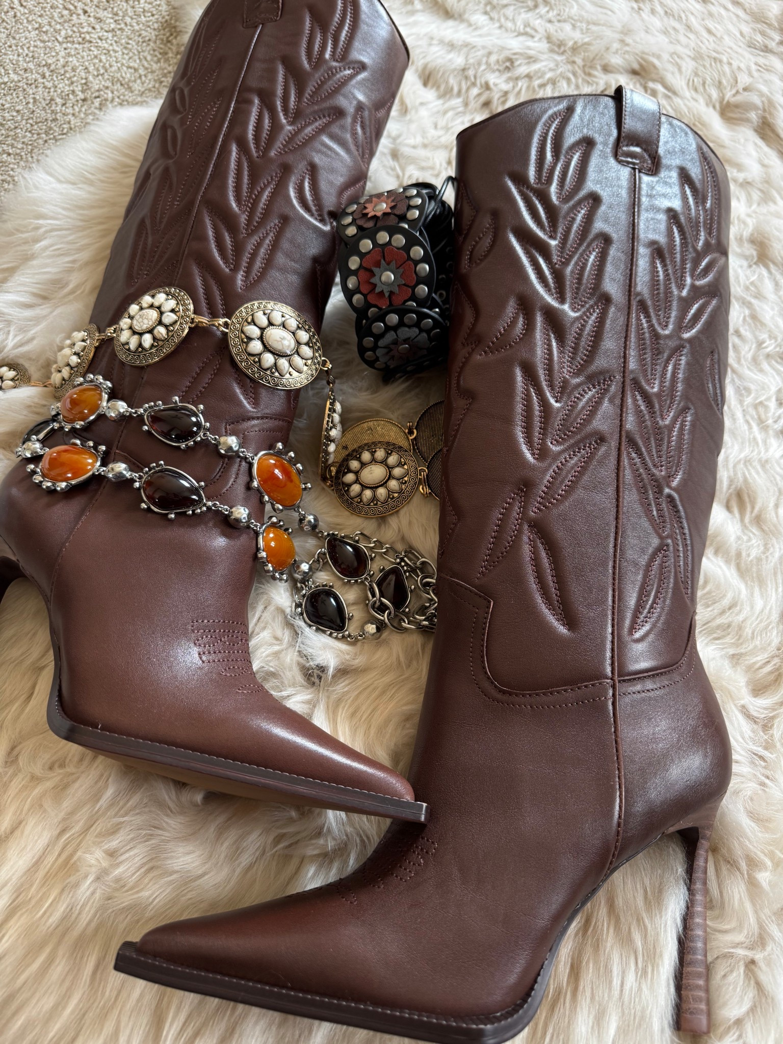I am in loveeee!!! These boots are perfect! 

Western style, heeled boots, concho belts 

#LTKgrwm #LTKTravel #LTKdayinmylife