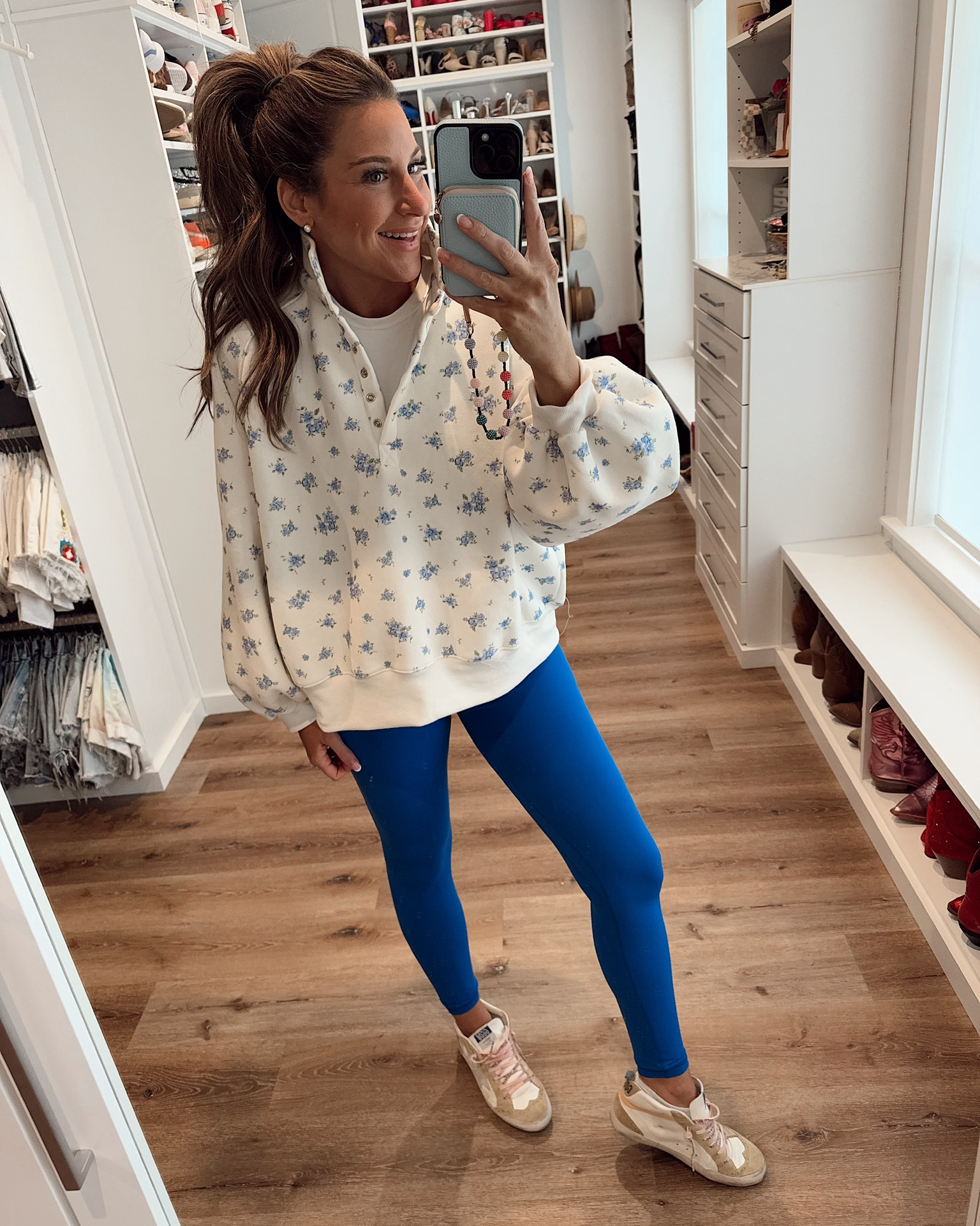 In a large floral pullover sweatshirt, medium crop tee, small leggings and sneakers - all fits tts.

#LTKStyleTip #LTKSeasonal #LTKShoeCrush