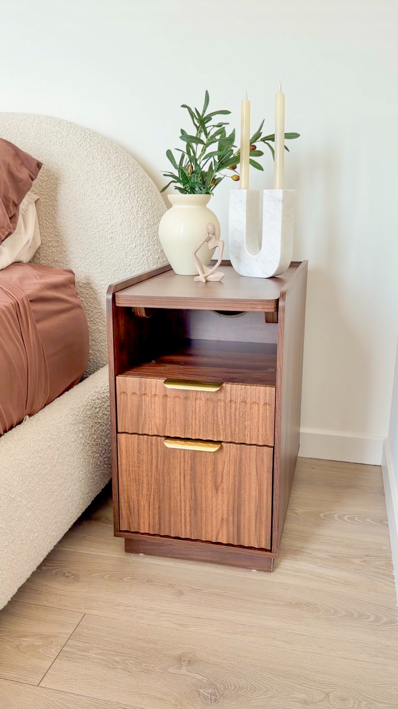 Functional, aesthetic, and includes a hidden outlet charging station! The top even slides out to become a table, and the back has a shelf and hidden storage! Perfect for nightstands or side tables :) 

 #LTKHome