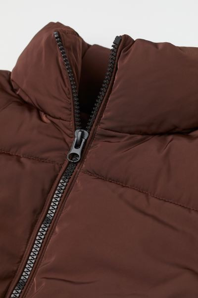 Short padded jacket in woven fabric. Stand-up collar, zipper at front, side pockets, and elastici... | H&M (US + CA)