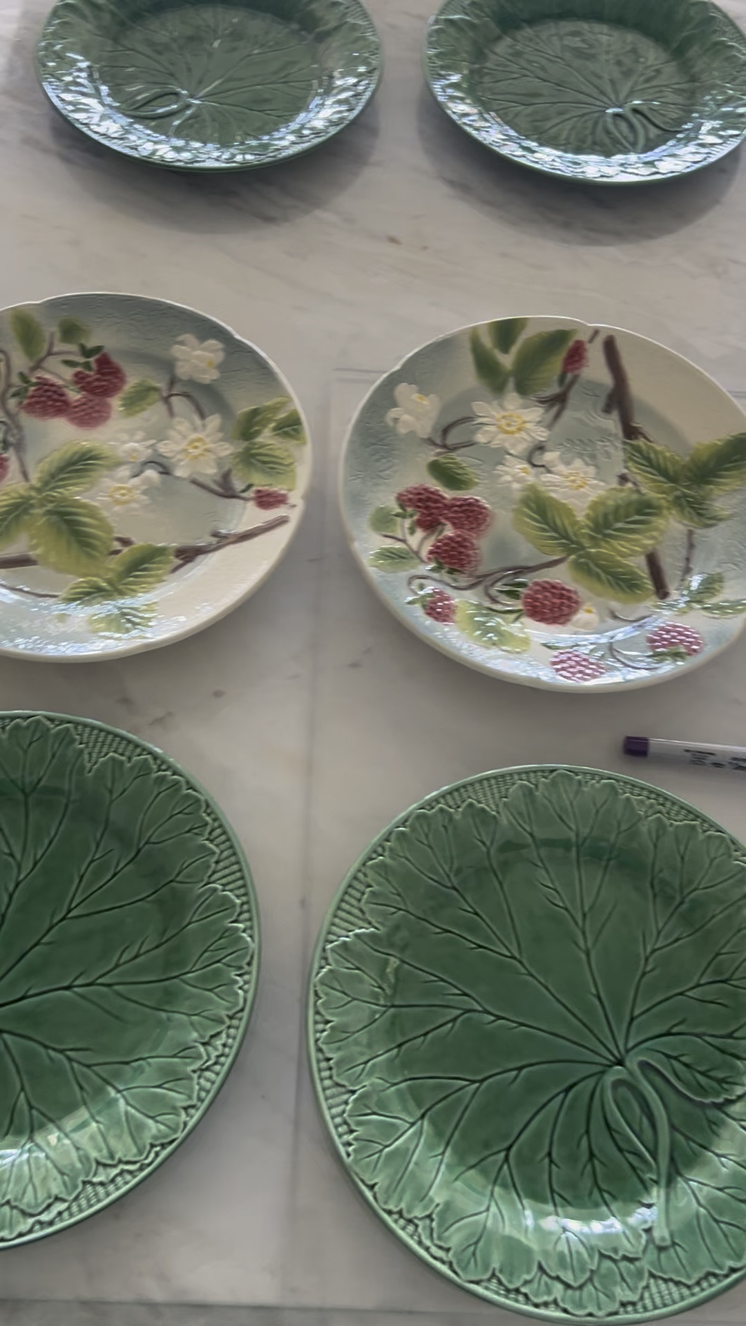 Working on hanging up my new antique mall majolica finds.  I love these raspberry plates and they look great with the green wedgewood leaf plates.  I have rounded up some exact options and some similar ones as well.  I am also linking the acrylic cutting boards I use in our kitchen and bar to protect our marble.

#LTKParties #LTKFindsUnder50 #LTKHome