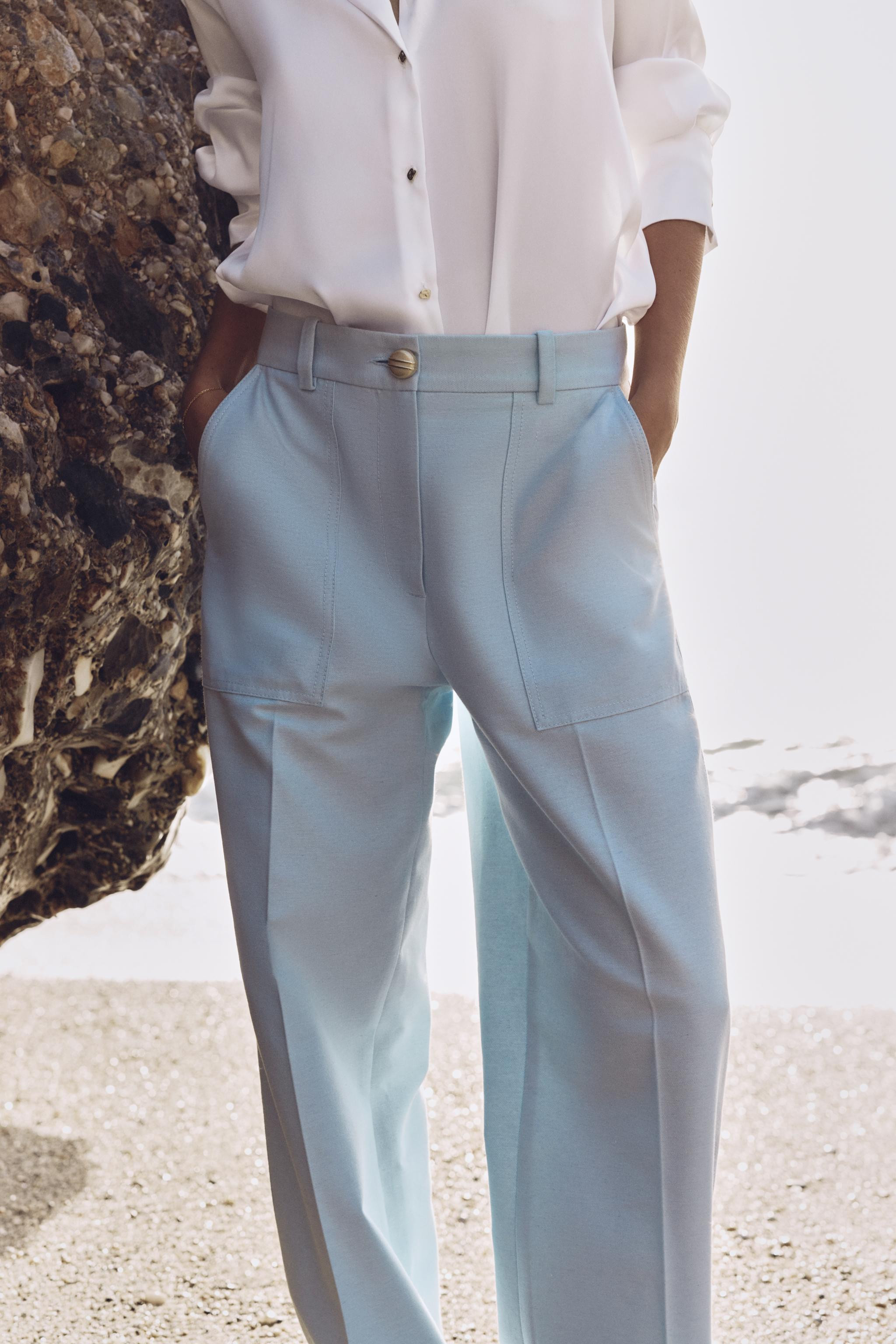 High-waisted pants with front pockets and back false flap pockets with button. Straight leg. Fron... | Zara US